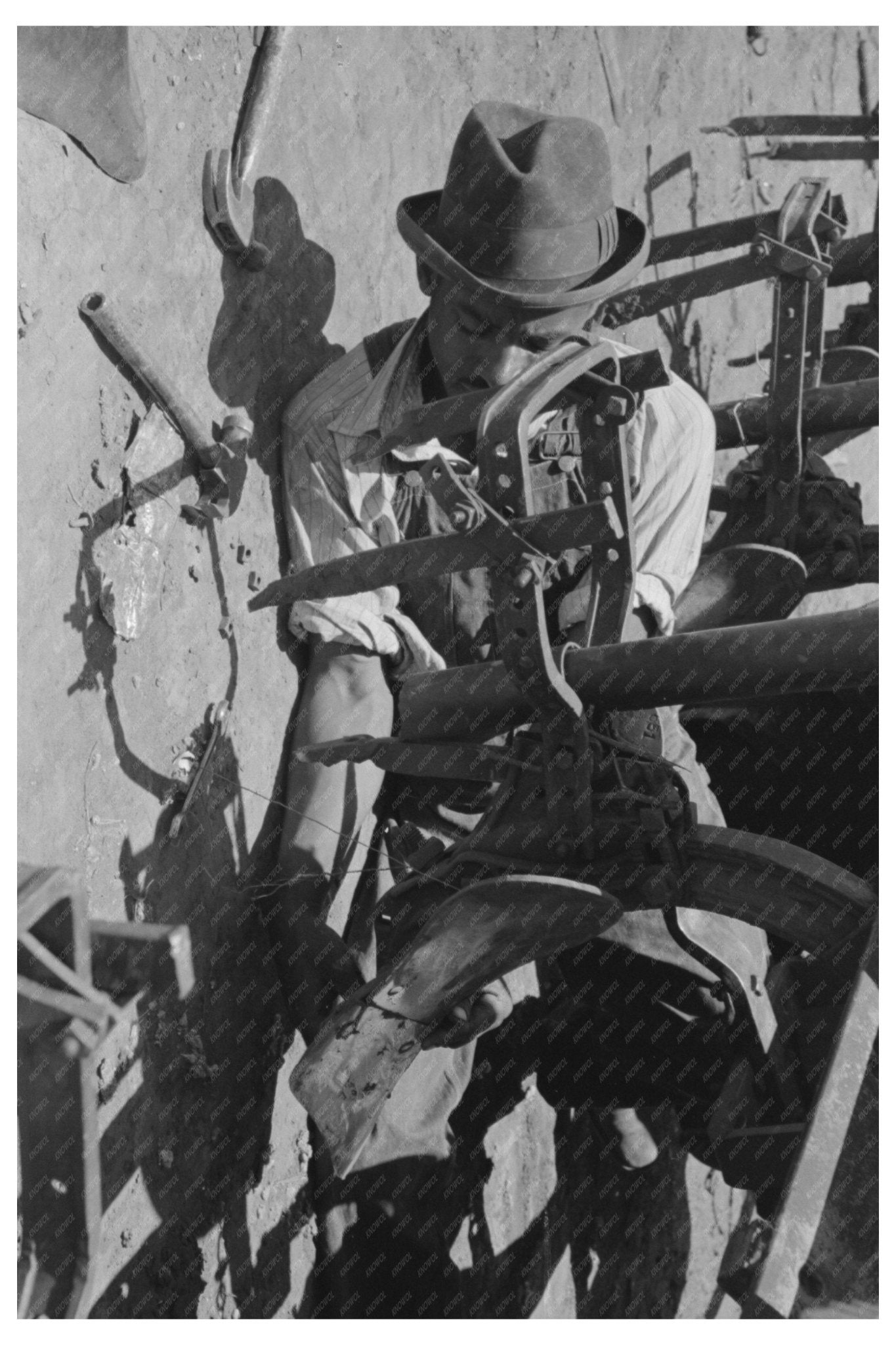 1939 Vintage Image of Laborer Adjusting Cotton Planter - Available at KNOWOL