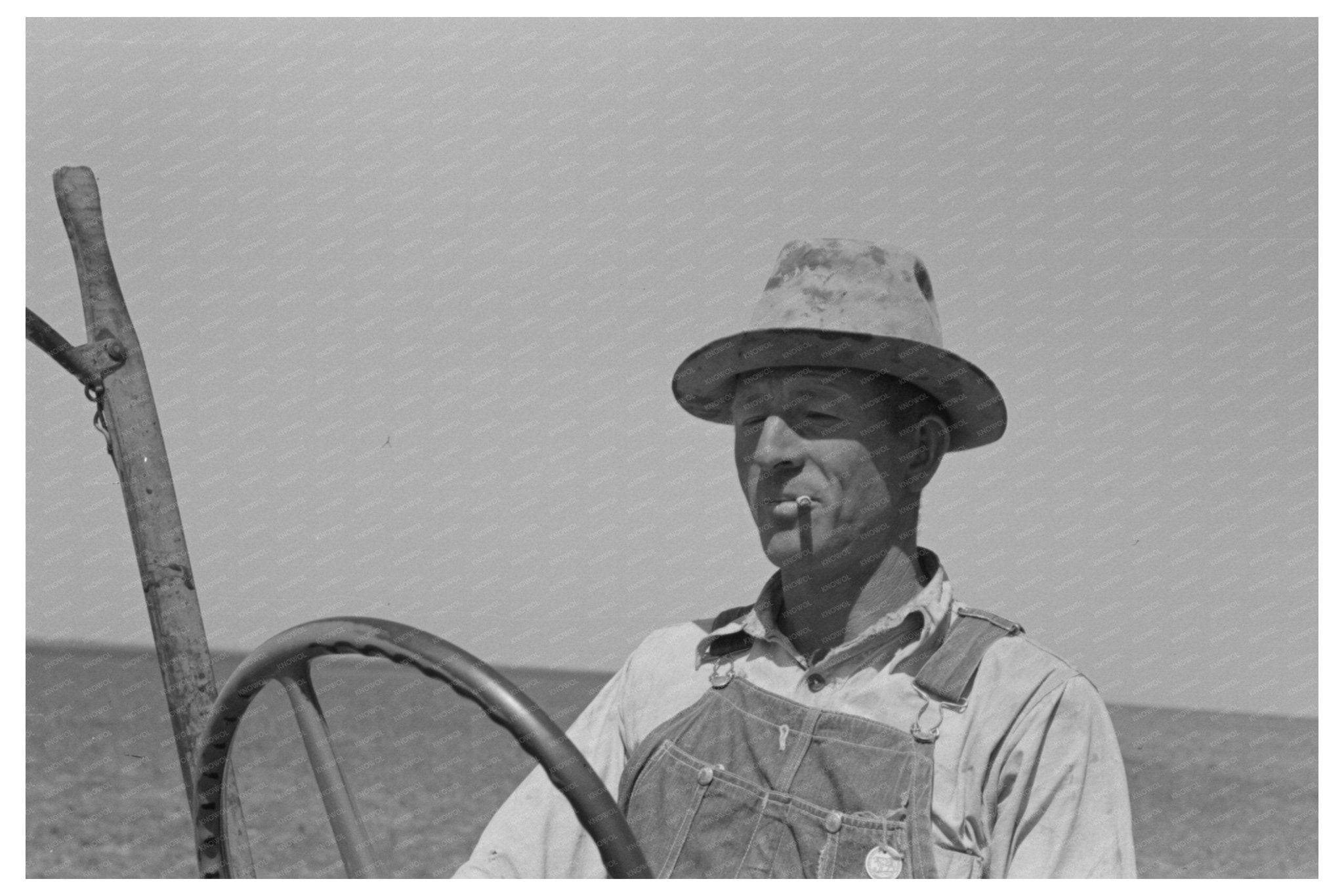 1939 Vintage Image of Laborer Adjusting Tractor Planter - Available at KNOWOL