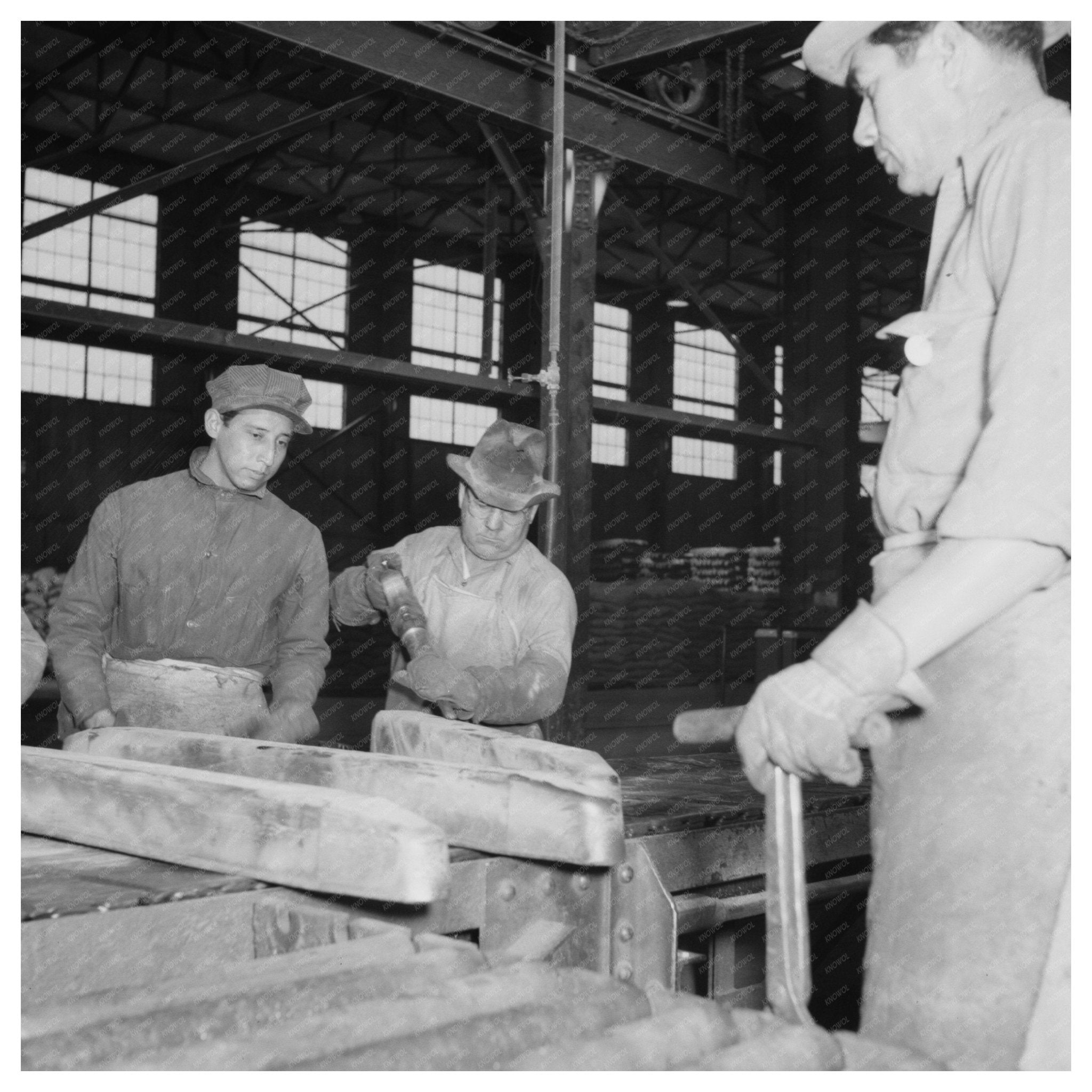 1942 Vintage Photo of Workman Trimming Ingot in El Paso - Available at KNOWOL