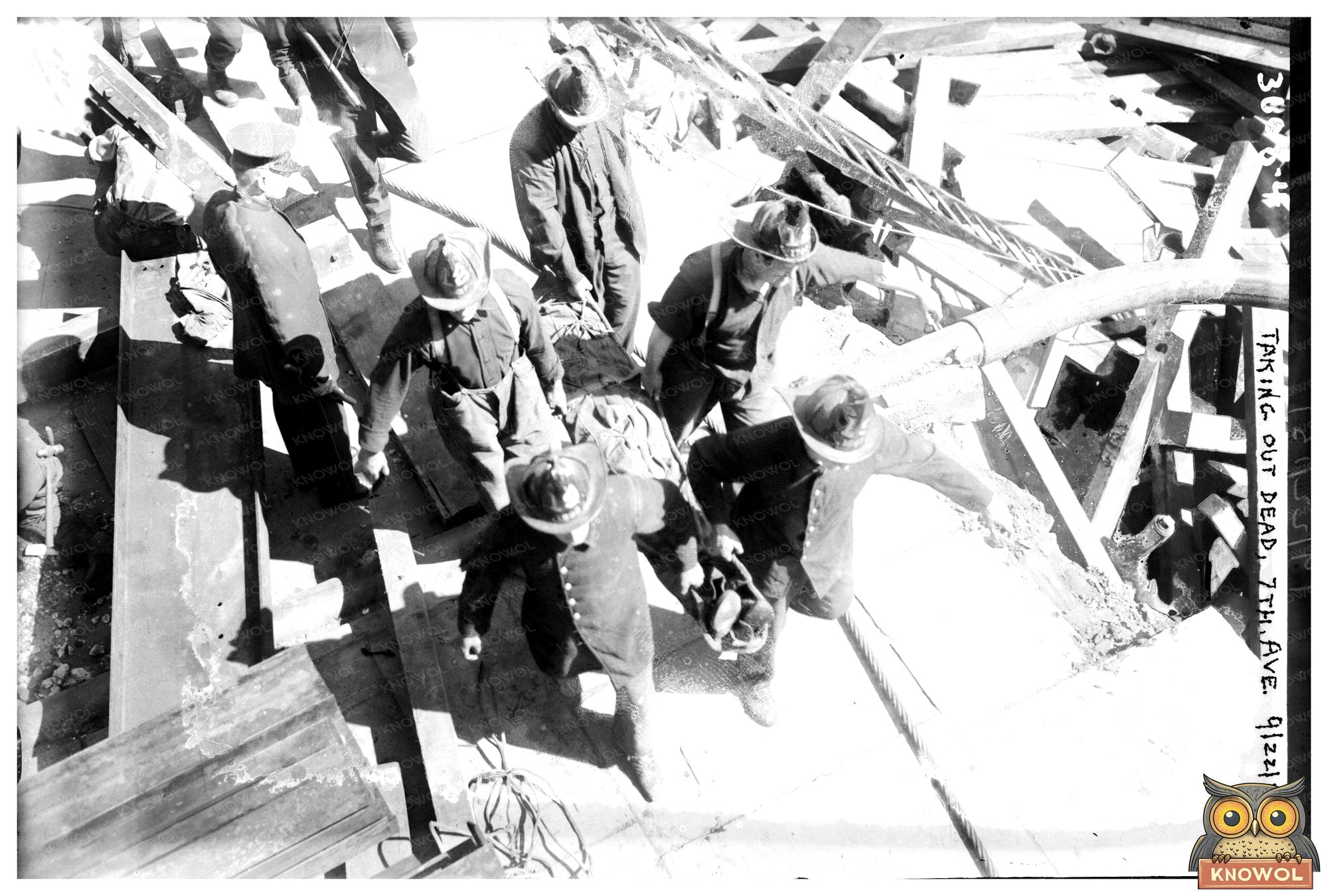 Somber Scene: Recovery Efforts on 7th Avenue, 1915