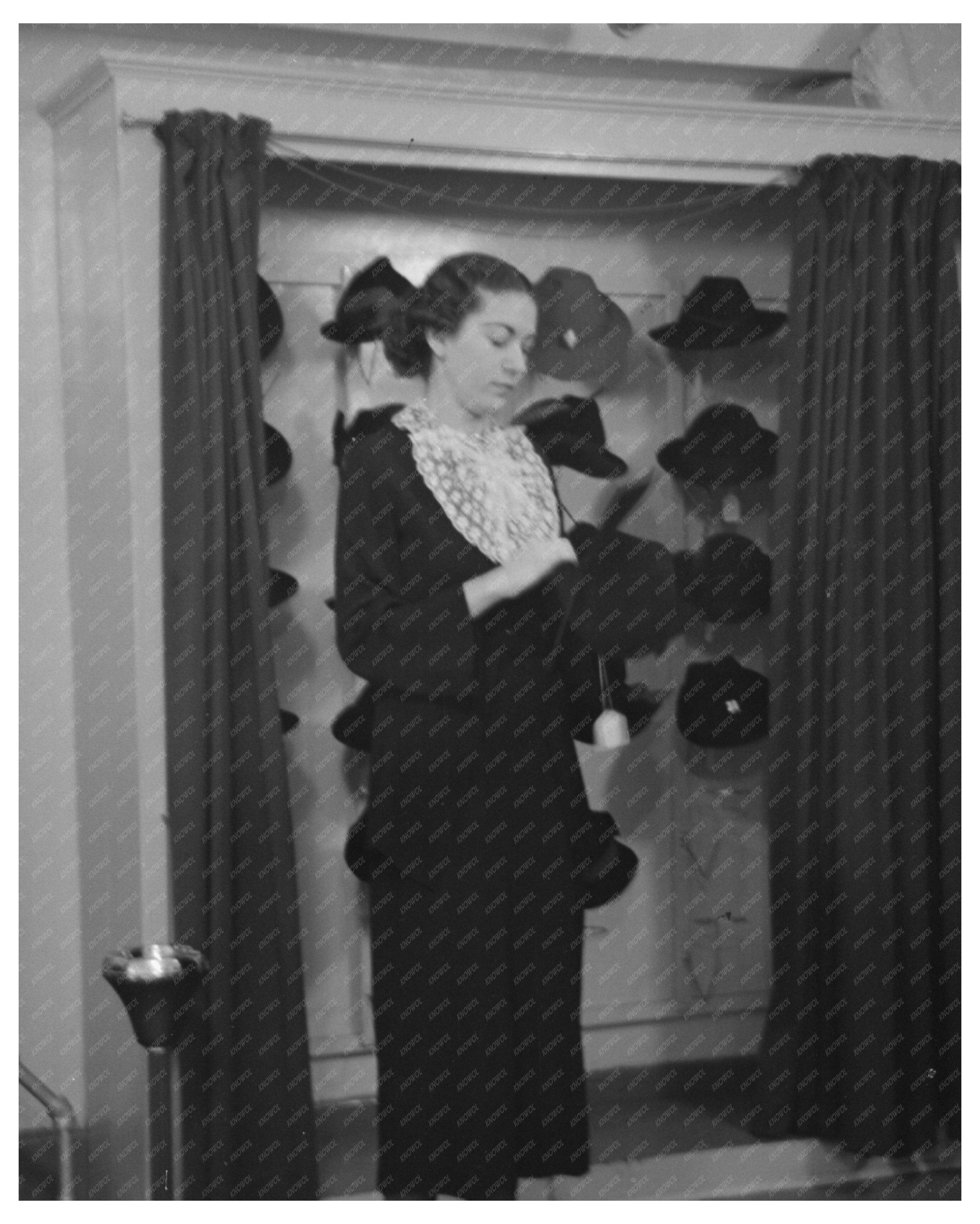 Model Trying on Hat in New York City Showroom 1936