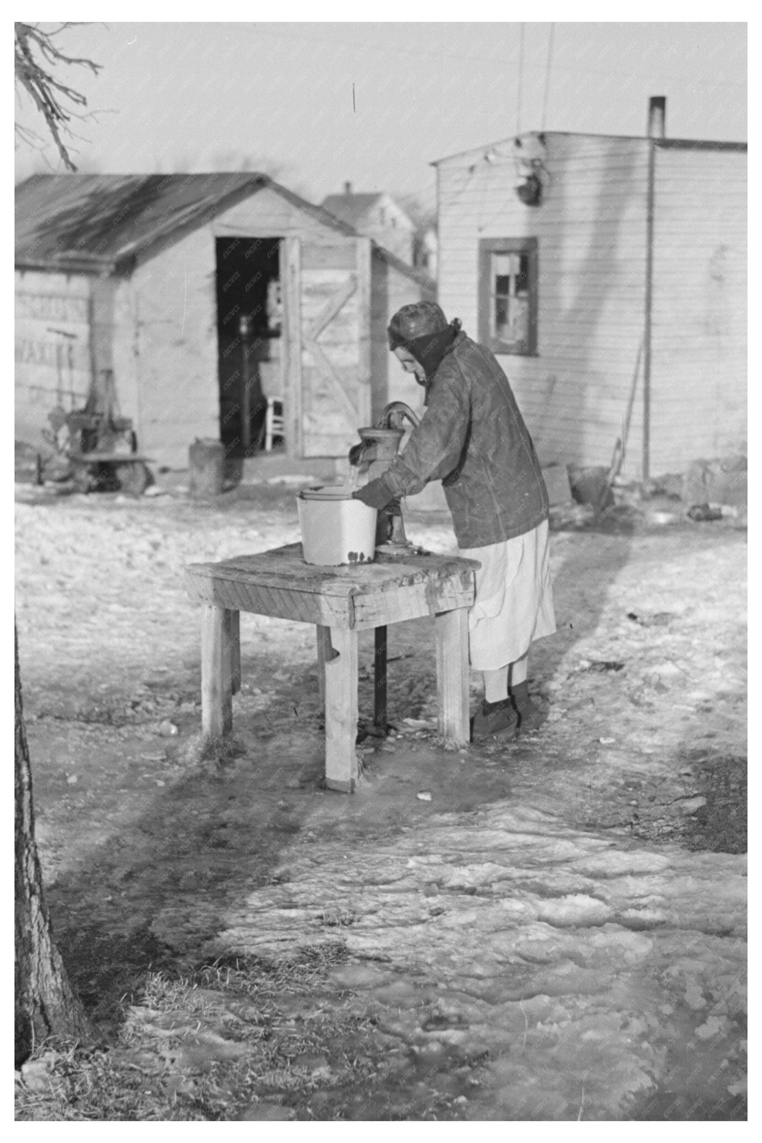 Woman Pumping Water for Laundry in Shantytown 1936