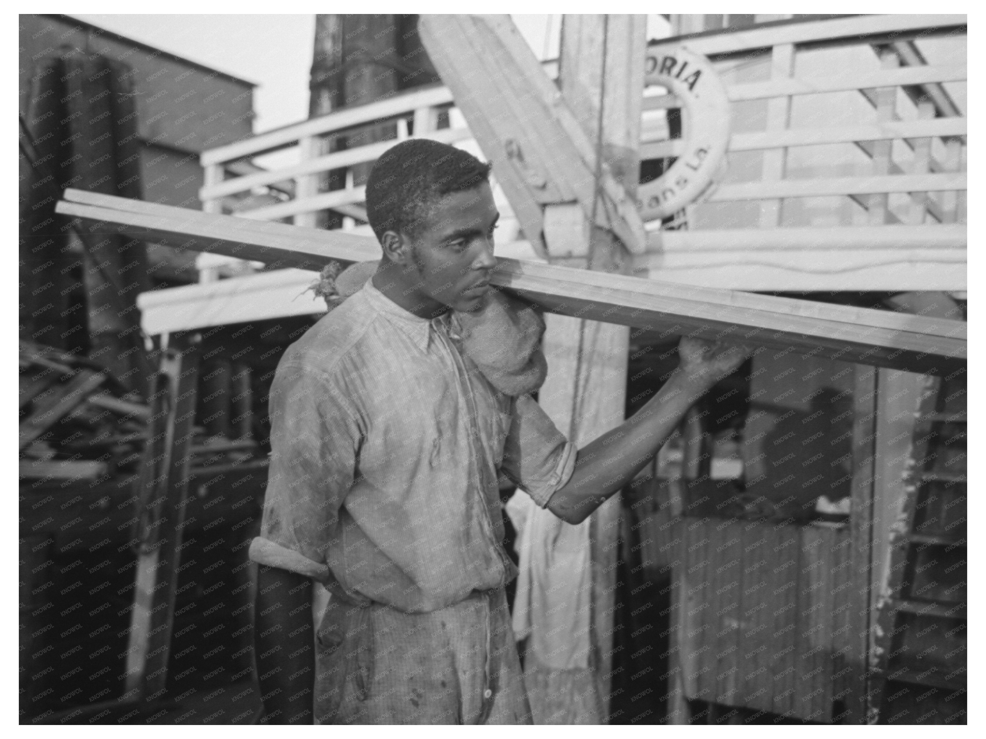 Stevedore Carrying Lumber in New Orleans September 1938