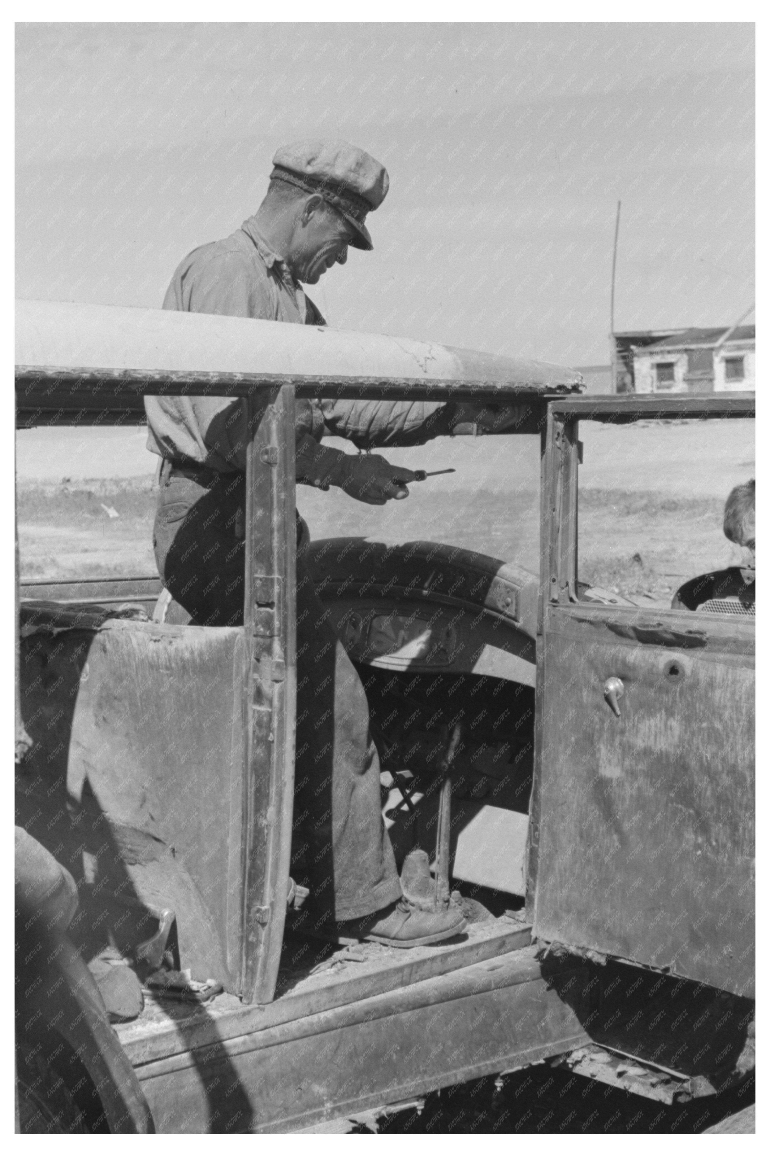 Migrant Auto Wrecker Dismantling Car in Corpus Christi 1939