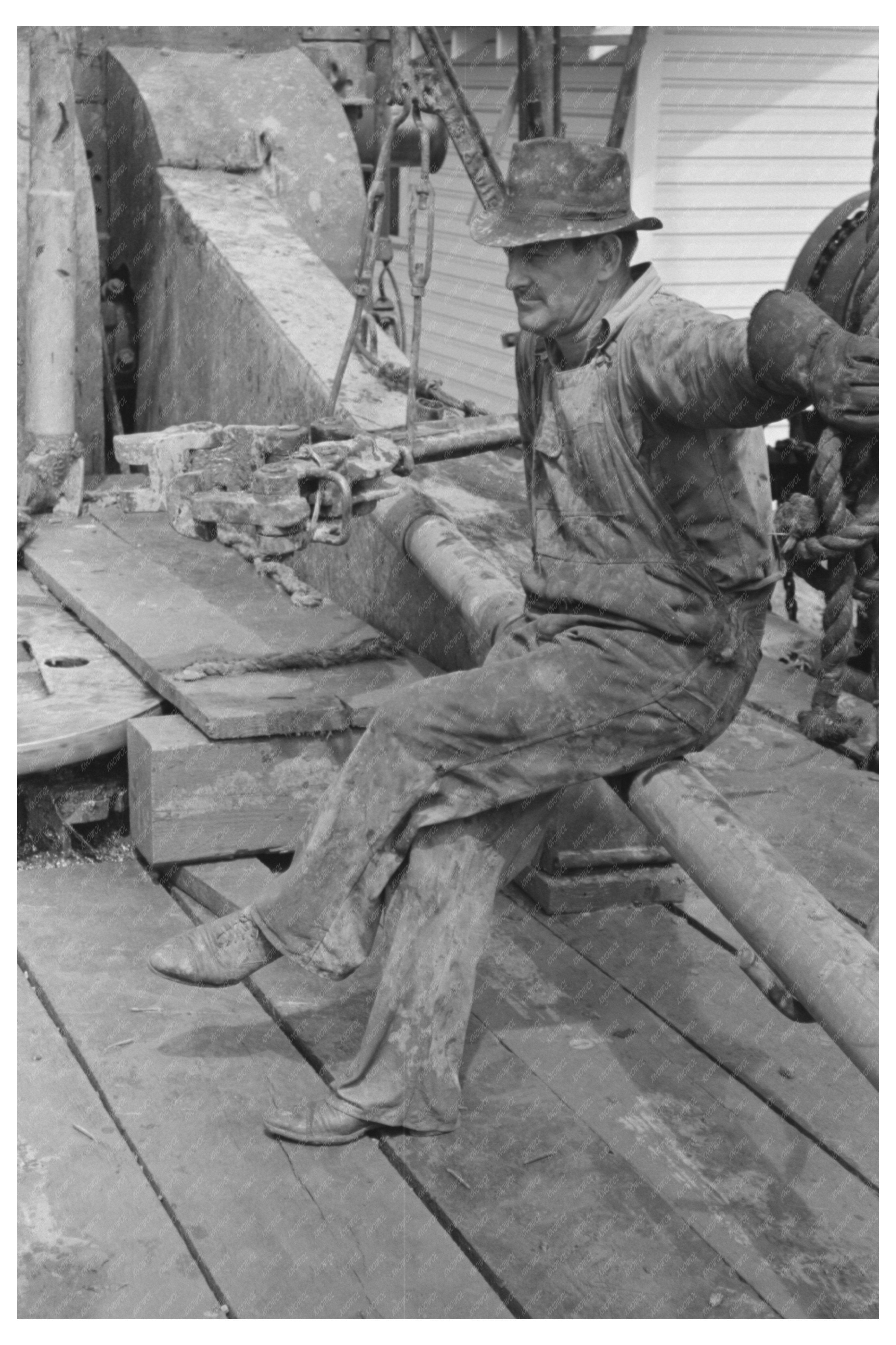 Oil Worker Resting on Pipe Kilgore Texas April 1939
