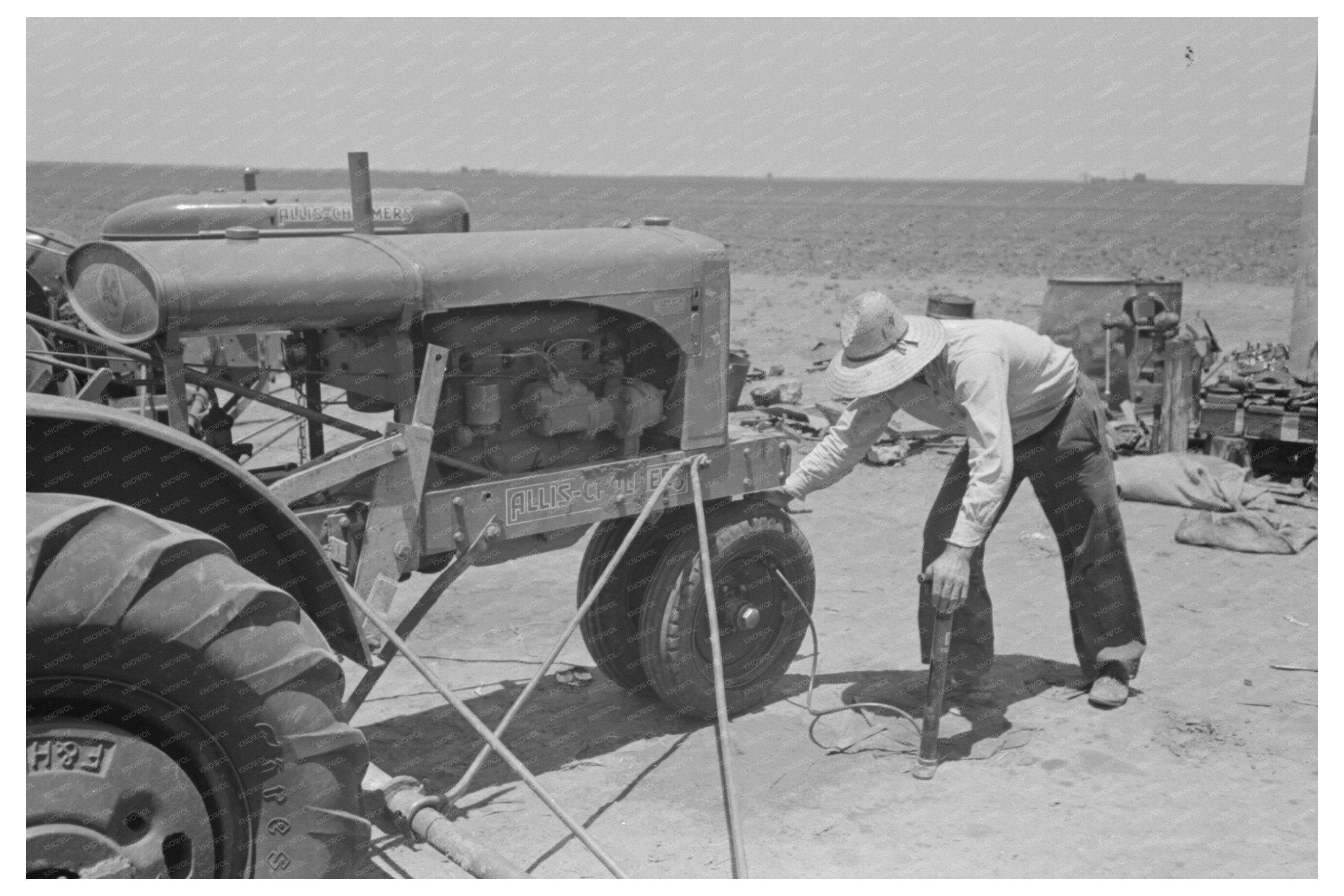 Day Laborer Pumps Air into Tractor Tire Ralls Texas 1939