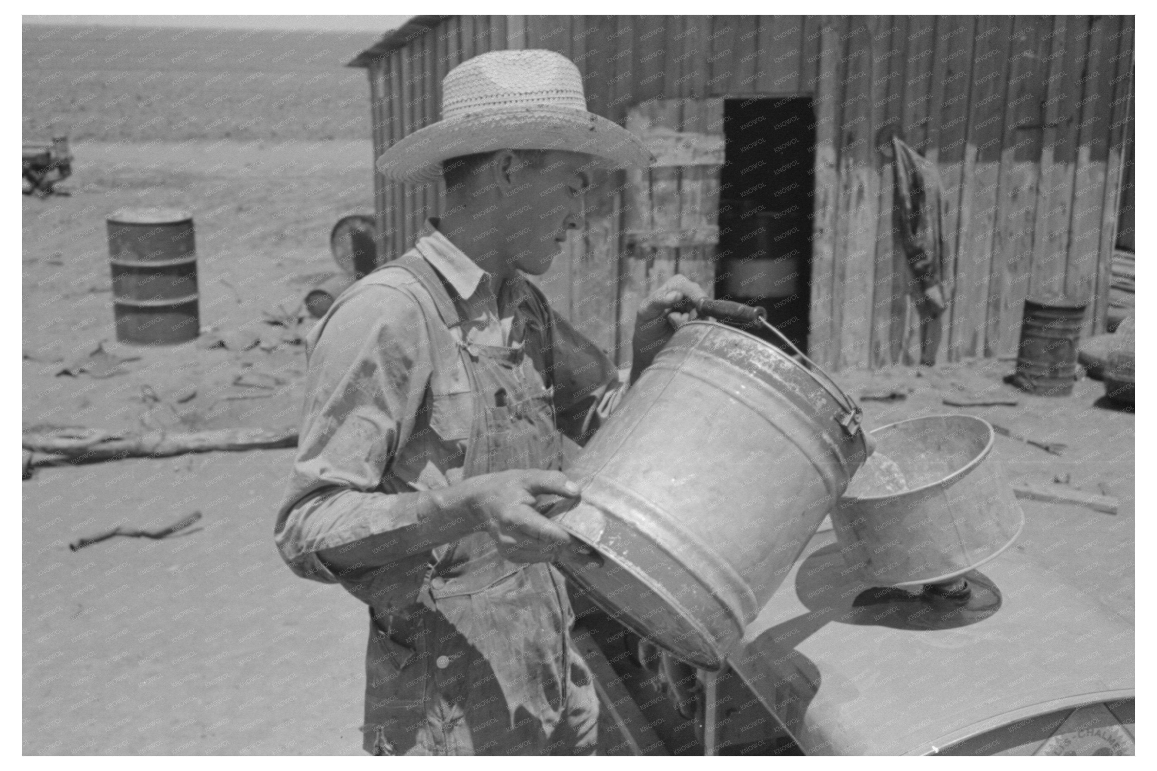 Vintage 1939 Man Pouring Gasoline into Tractor in Texas