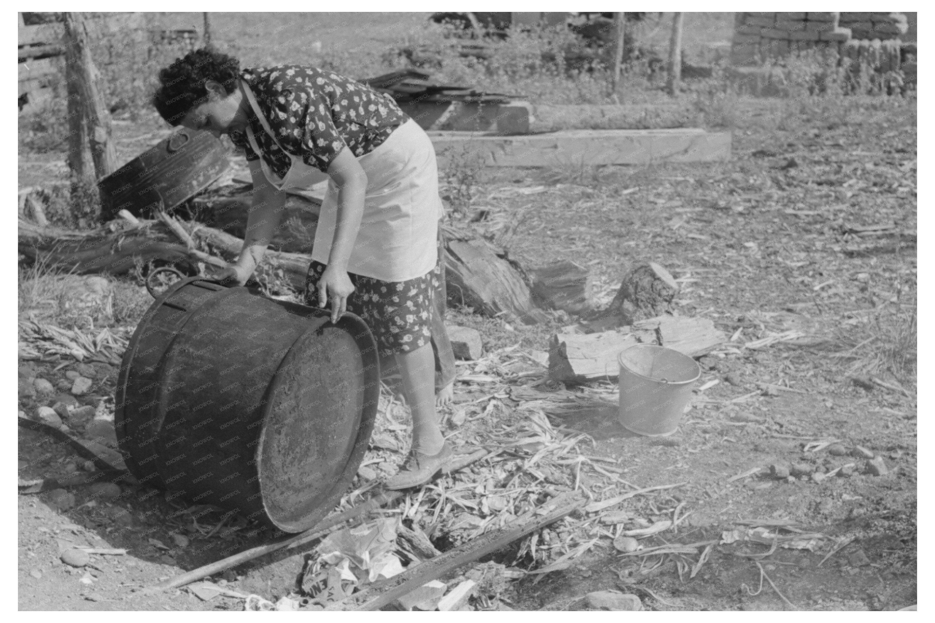 Ofelia Sandoval Rinsing Soap Kettle Taos County 1939