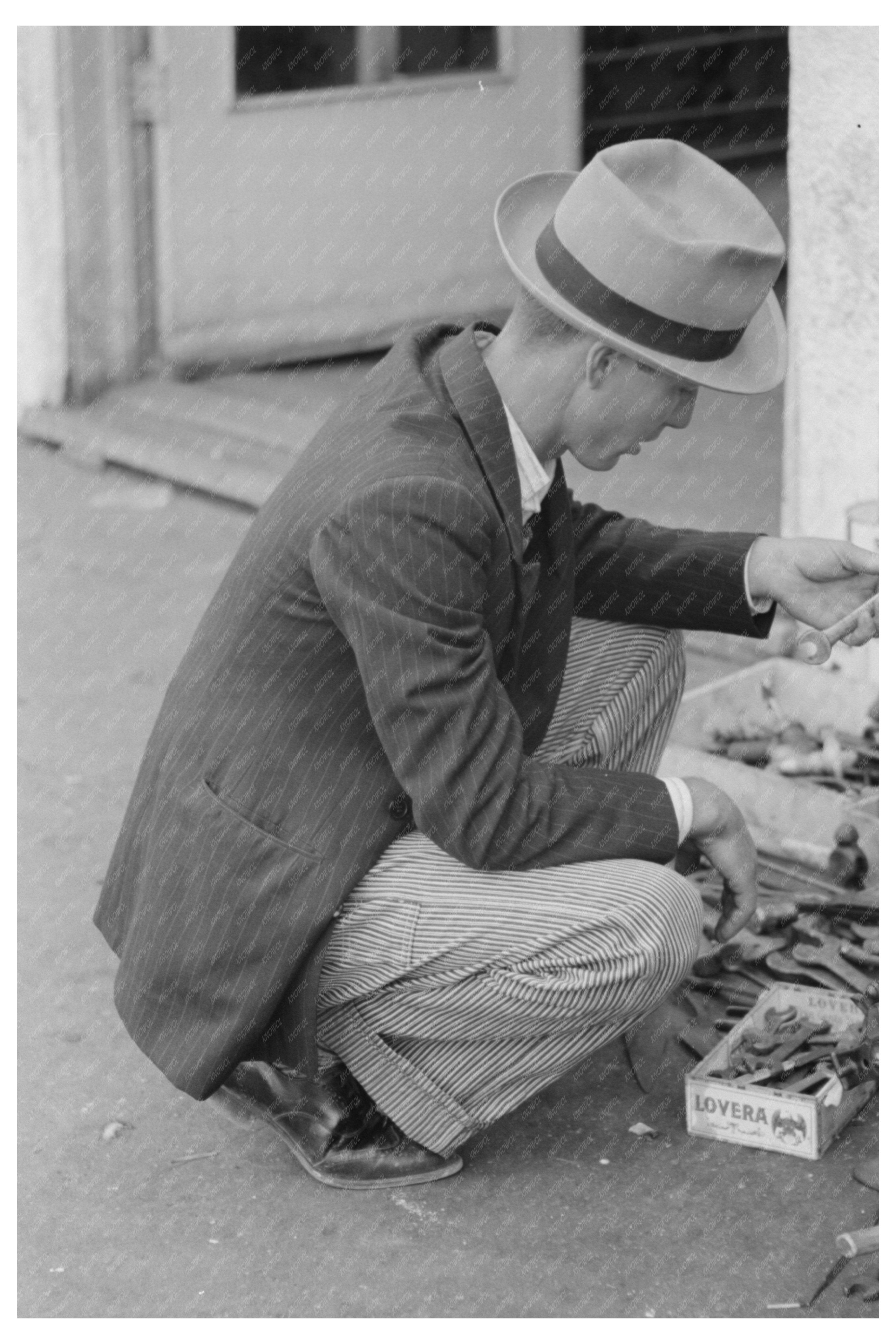 Man Examining Wrench in Waco Texas November 1939