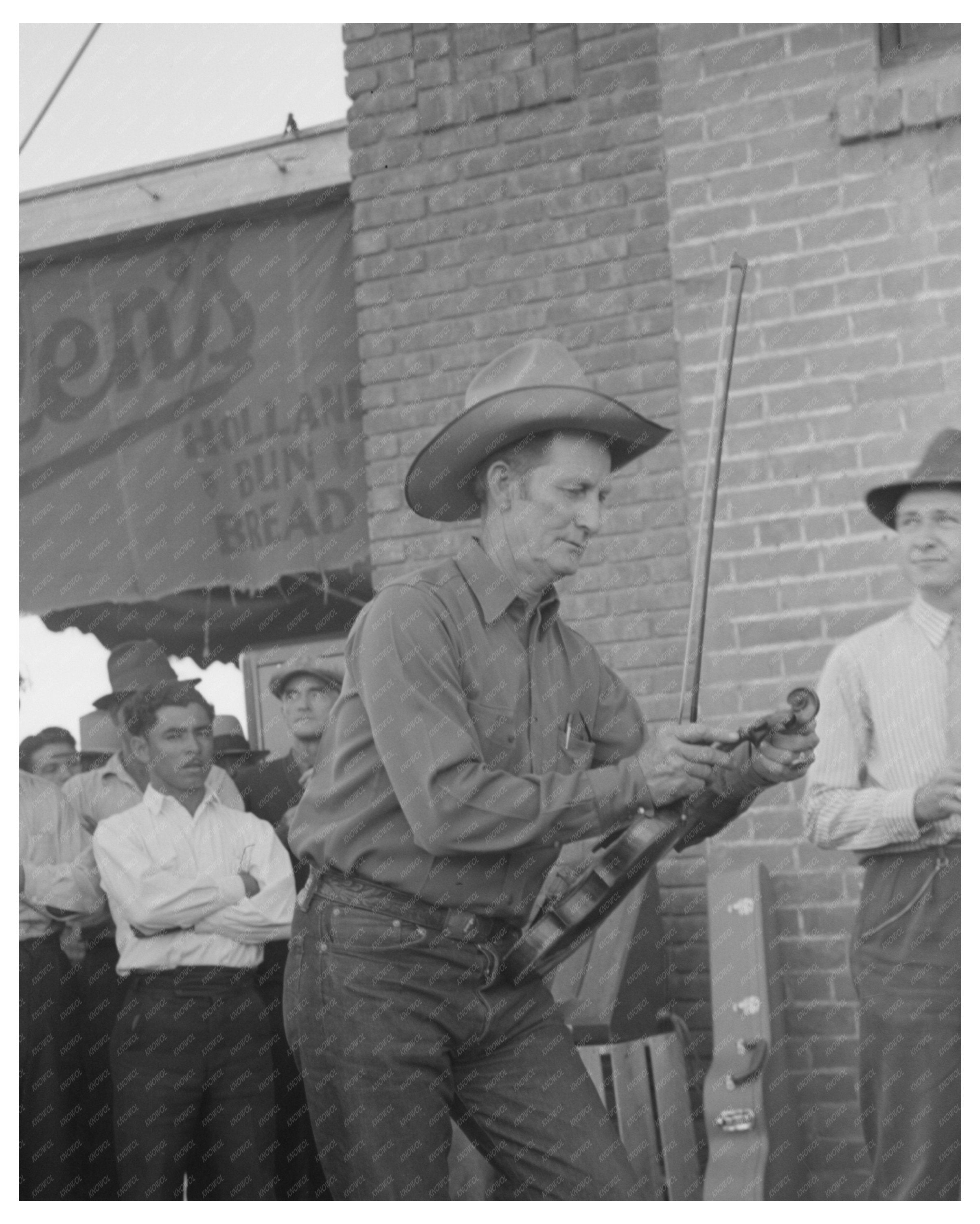 Musician Tunes Violin at Orchestra Outside Grocery Store 1940