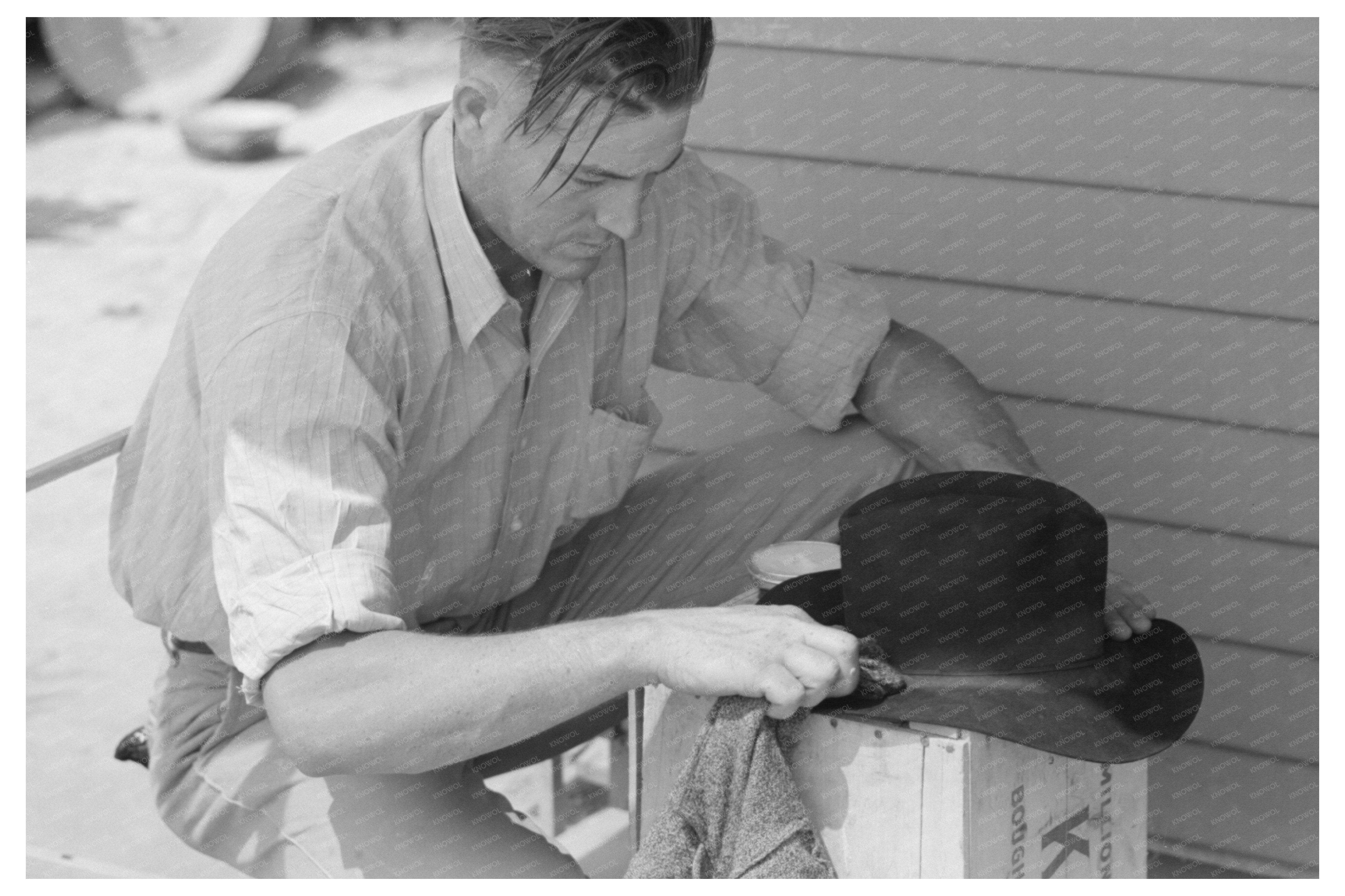 Migratory Laborer Cleaning Hat Agua Fria Camp 1940