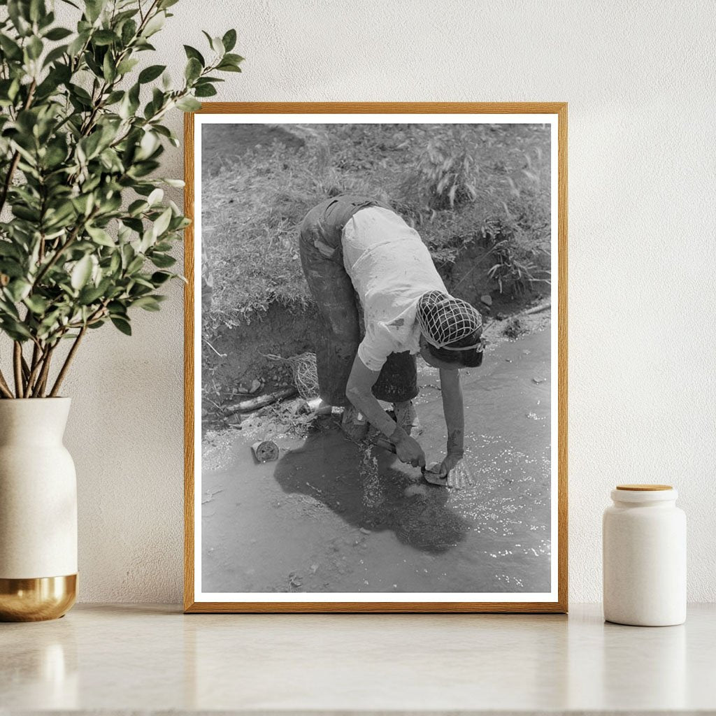 Man Washing Trowel in Chamisal New Mexico July 1940