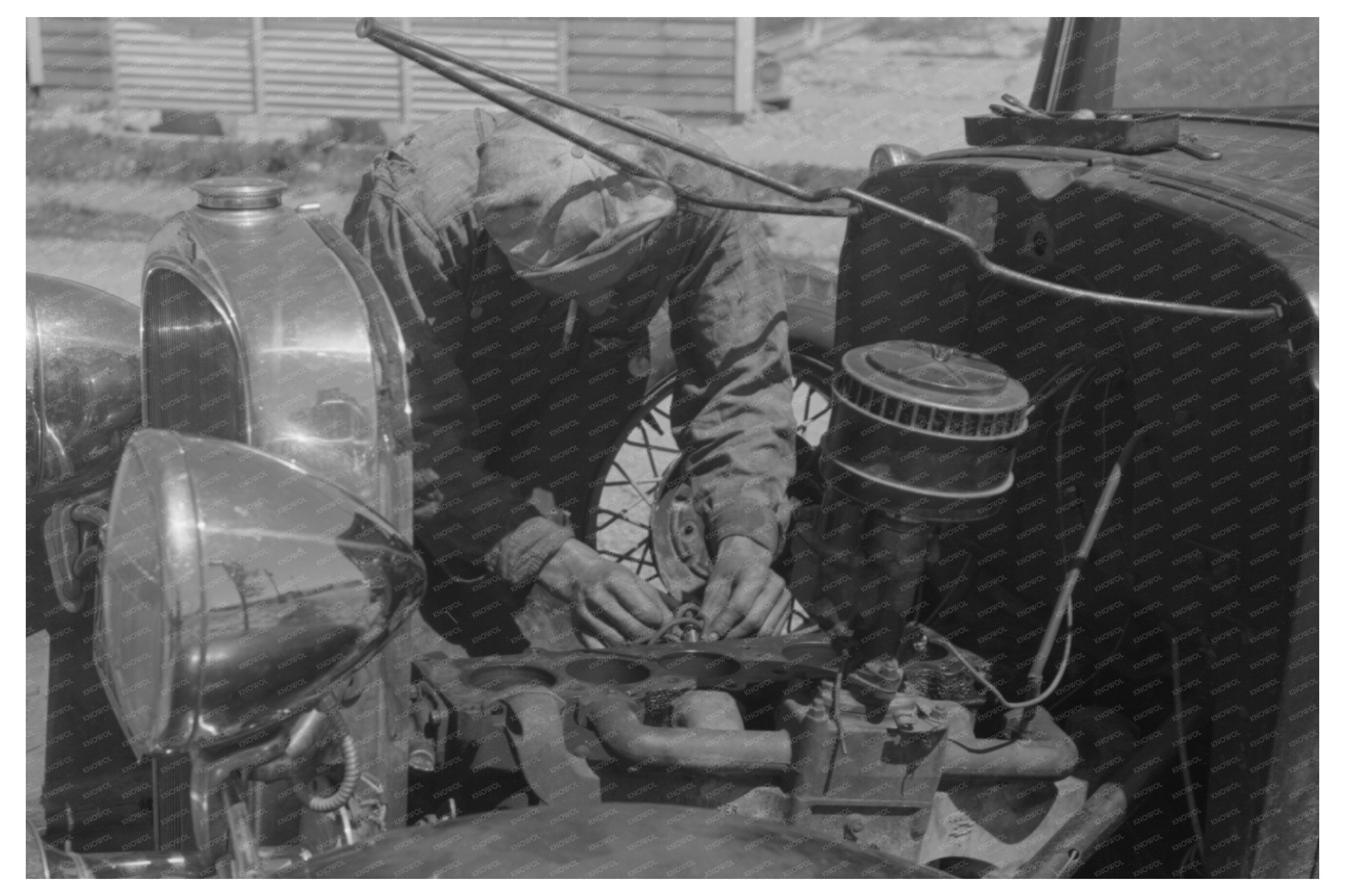 Farm Worker Repairing Car at Labor Camp Caldwell Idaho 1941