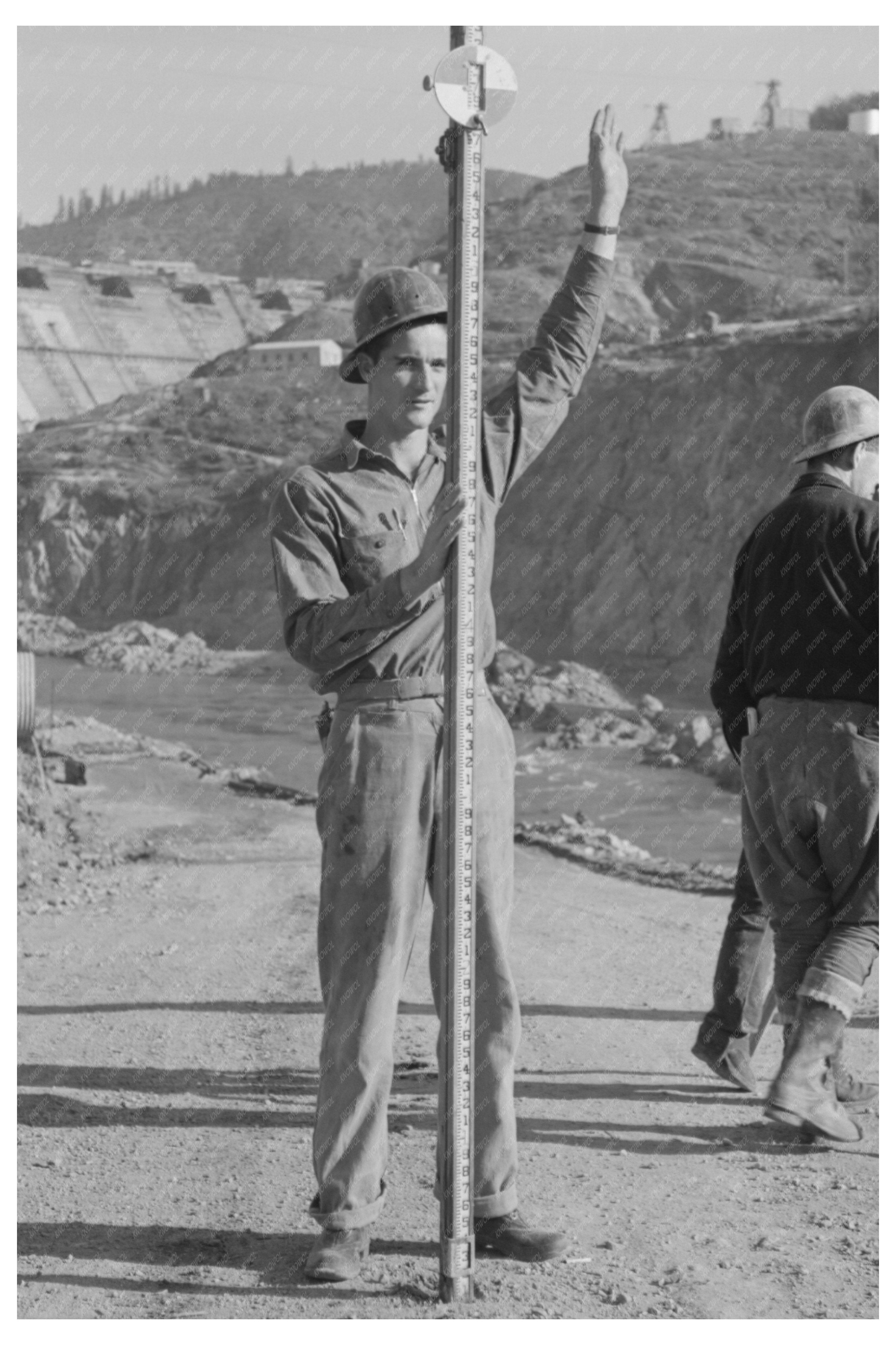 Workman Surveying at Shasta Dam December 1941 Image