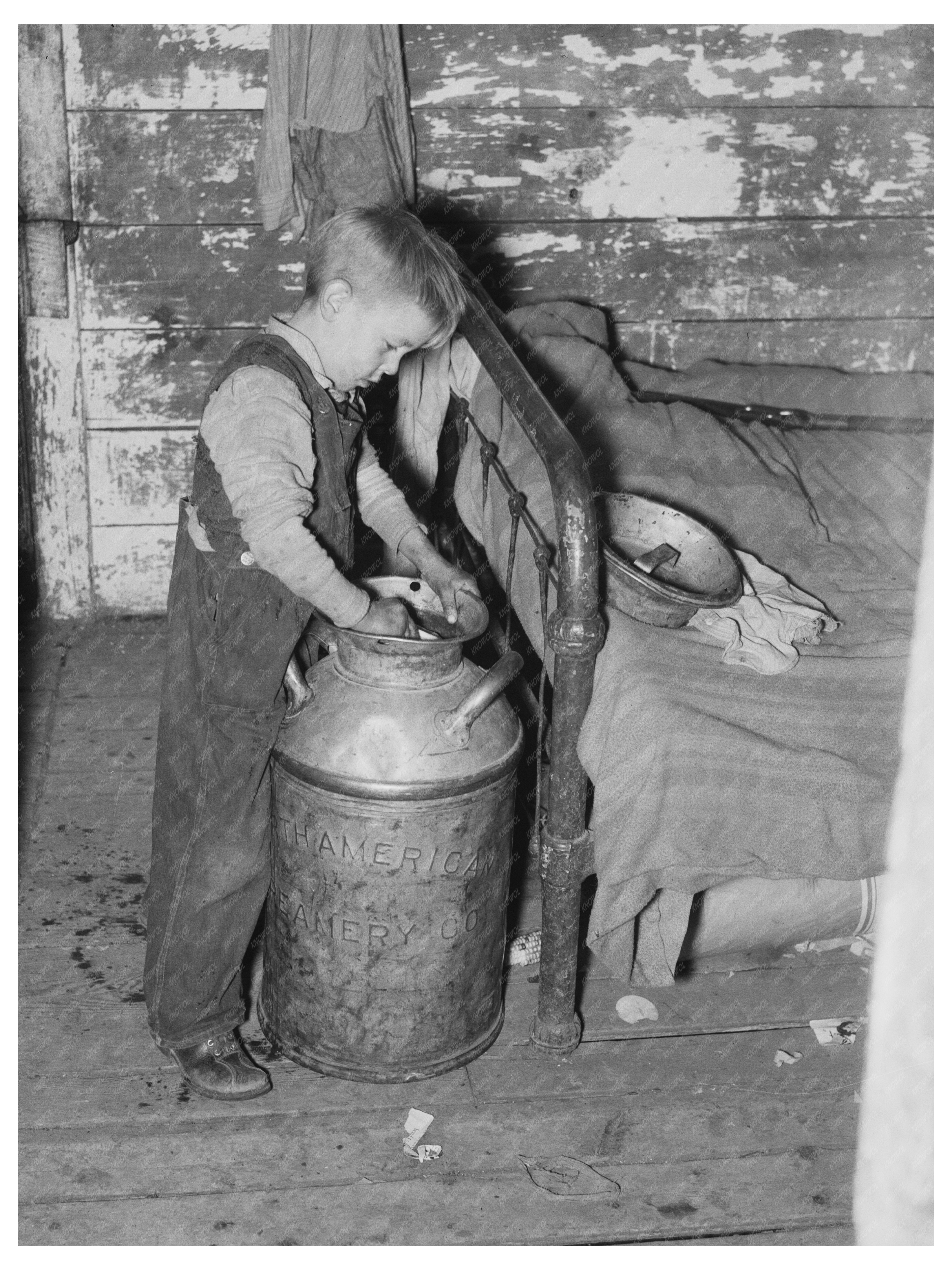 Son of Joe Kramer Dips Water from Milk Can 1937