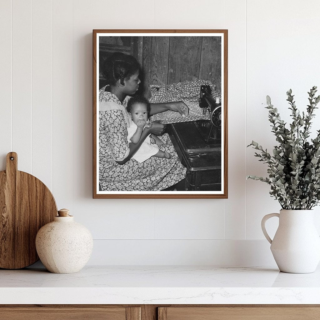 Sharecroppers Wife Sewing with Baby August 1938 Missouri