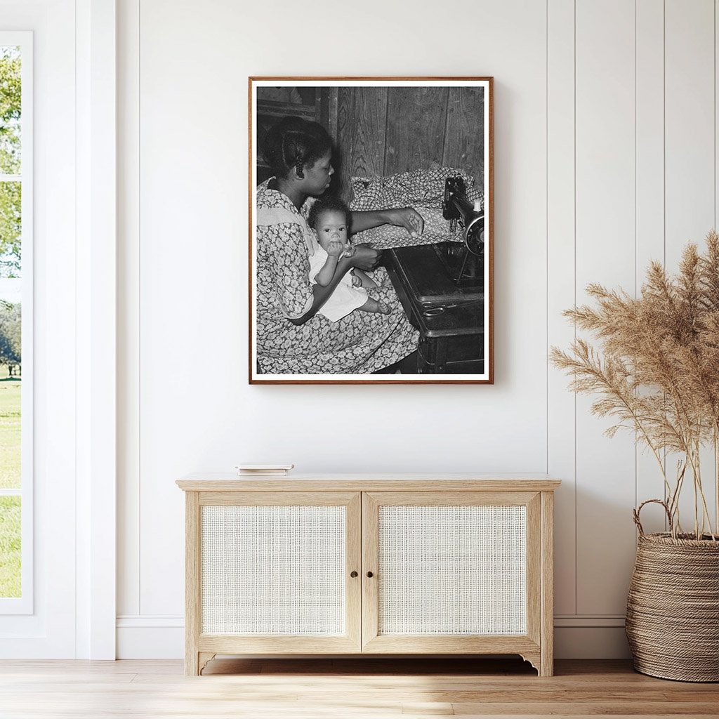 Sharecroppers Wife Sewing with Baby August 1938 Missouri