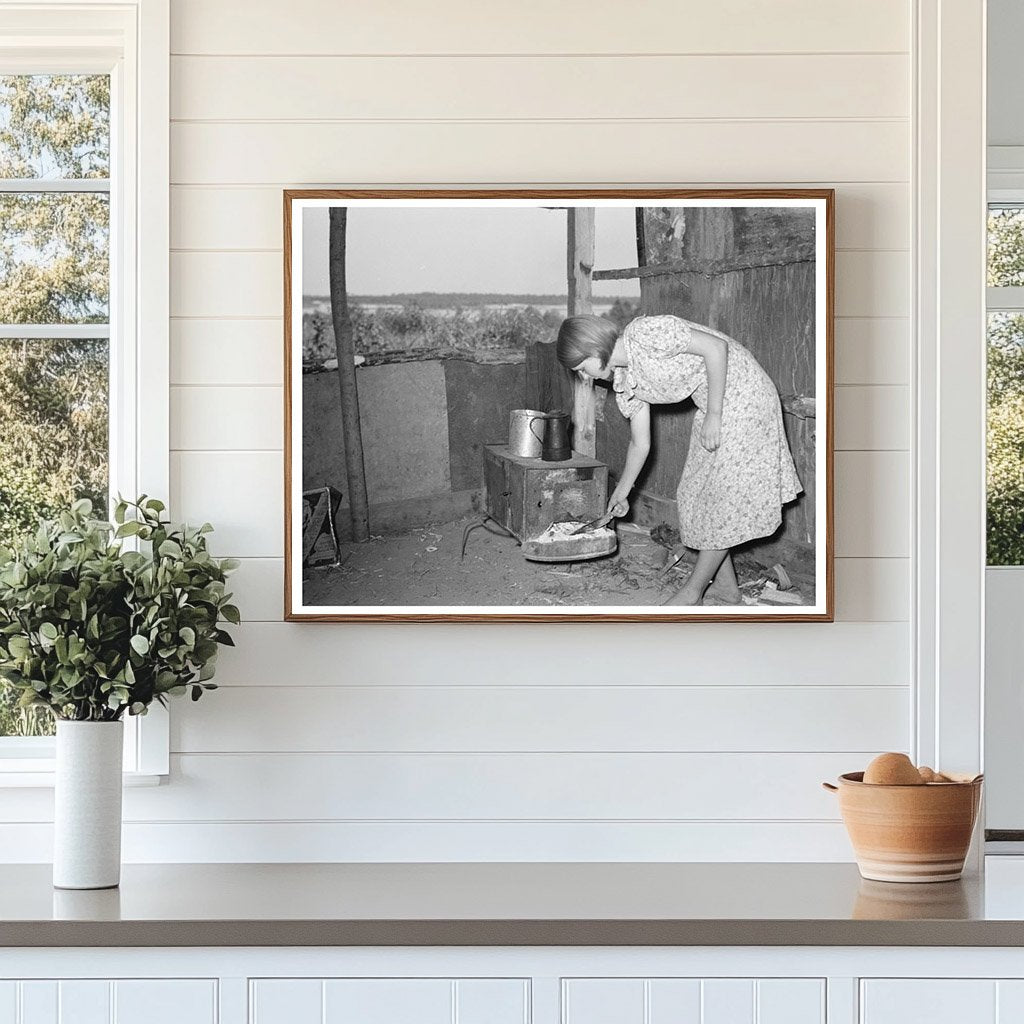 Girl Tending Fire in Tin Shack Caruthersville 1938