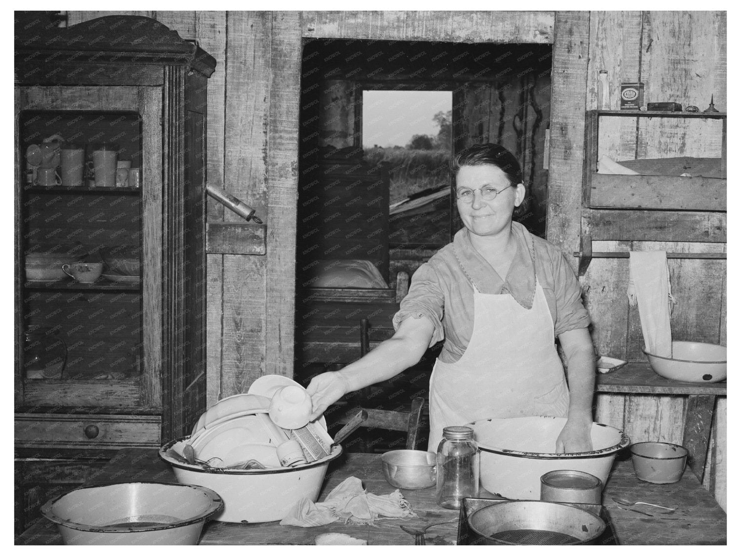 Mrs. M. LaBlanc Washing Dishes in Louisiana 1938