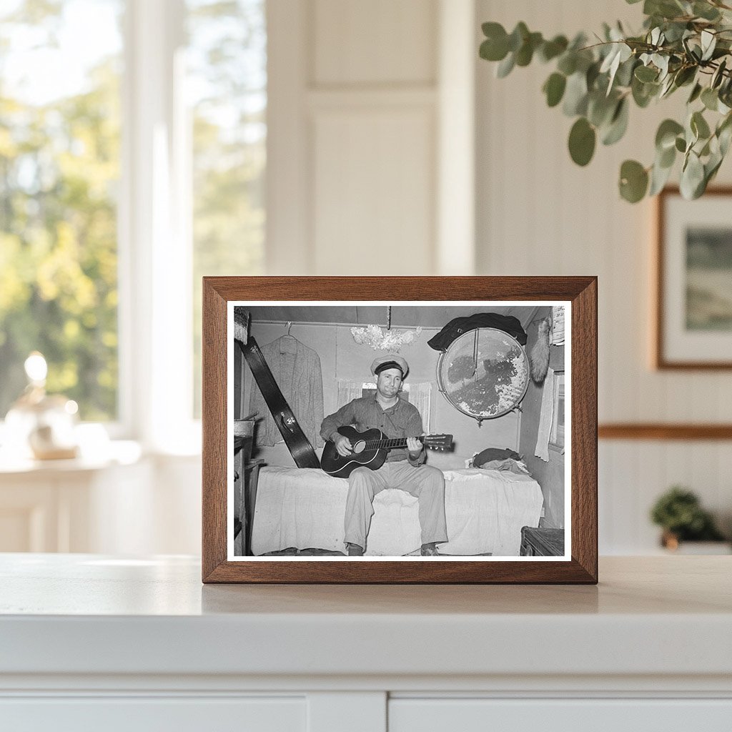 White Migrant Playing Guitar in Trailer Home 1939