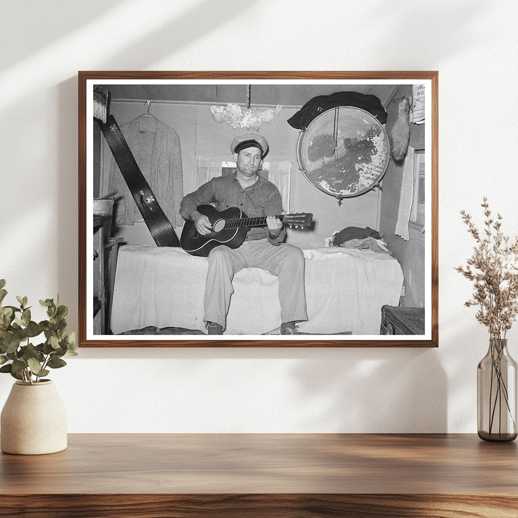 White Migrant Playing Guitar in Trailer Home 1939