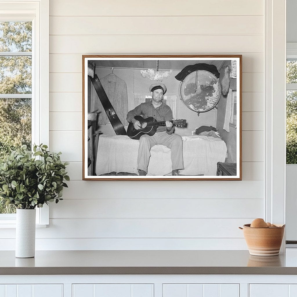 White Migrant Playing Guitar in Trailer Home 1939