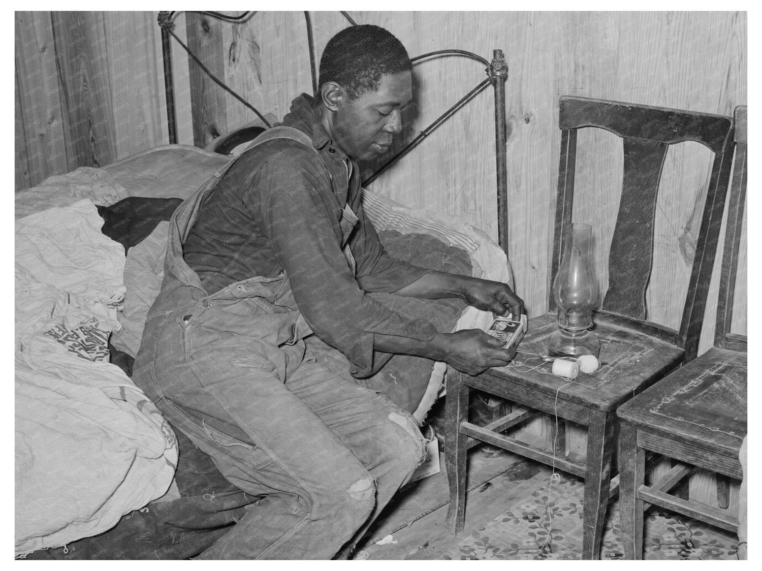 Man Lighting Lamp in Bedroom Louisiana April 1939