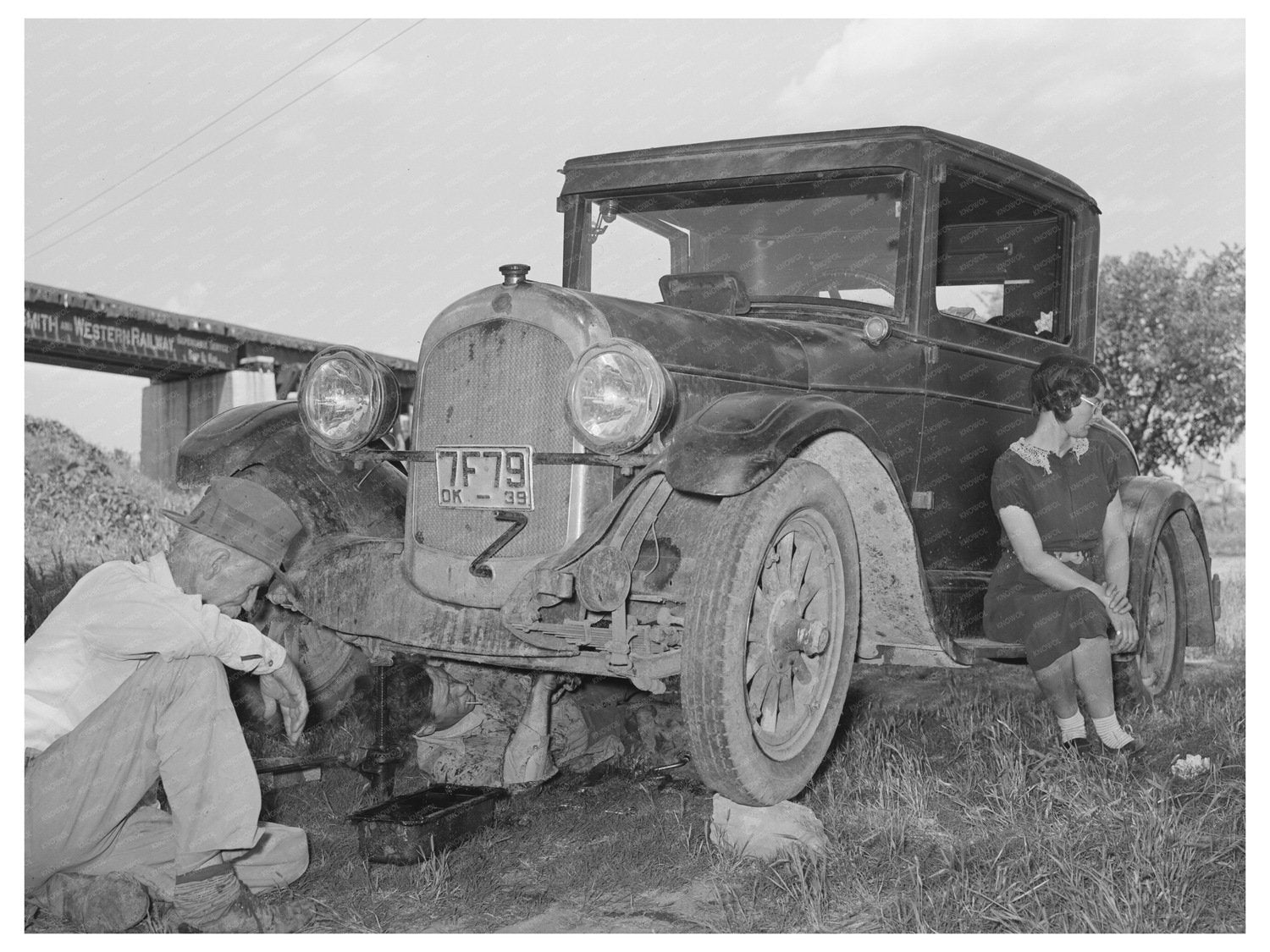 Migrant Steeple-Jack Family Working on Car 1939