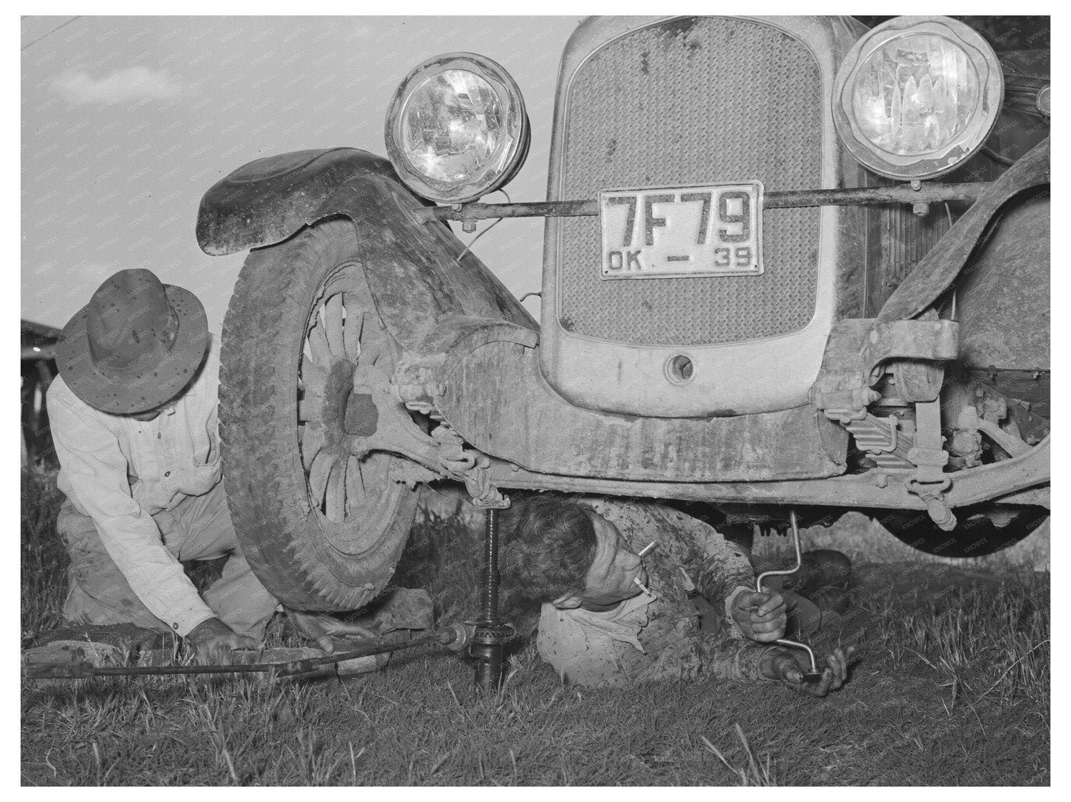 Migrant Steeplejack Fixing Car with Fathers Help 1939