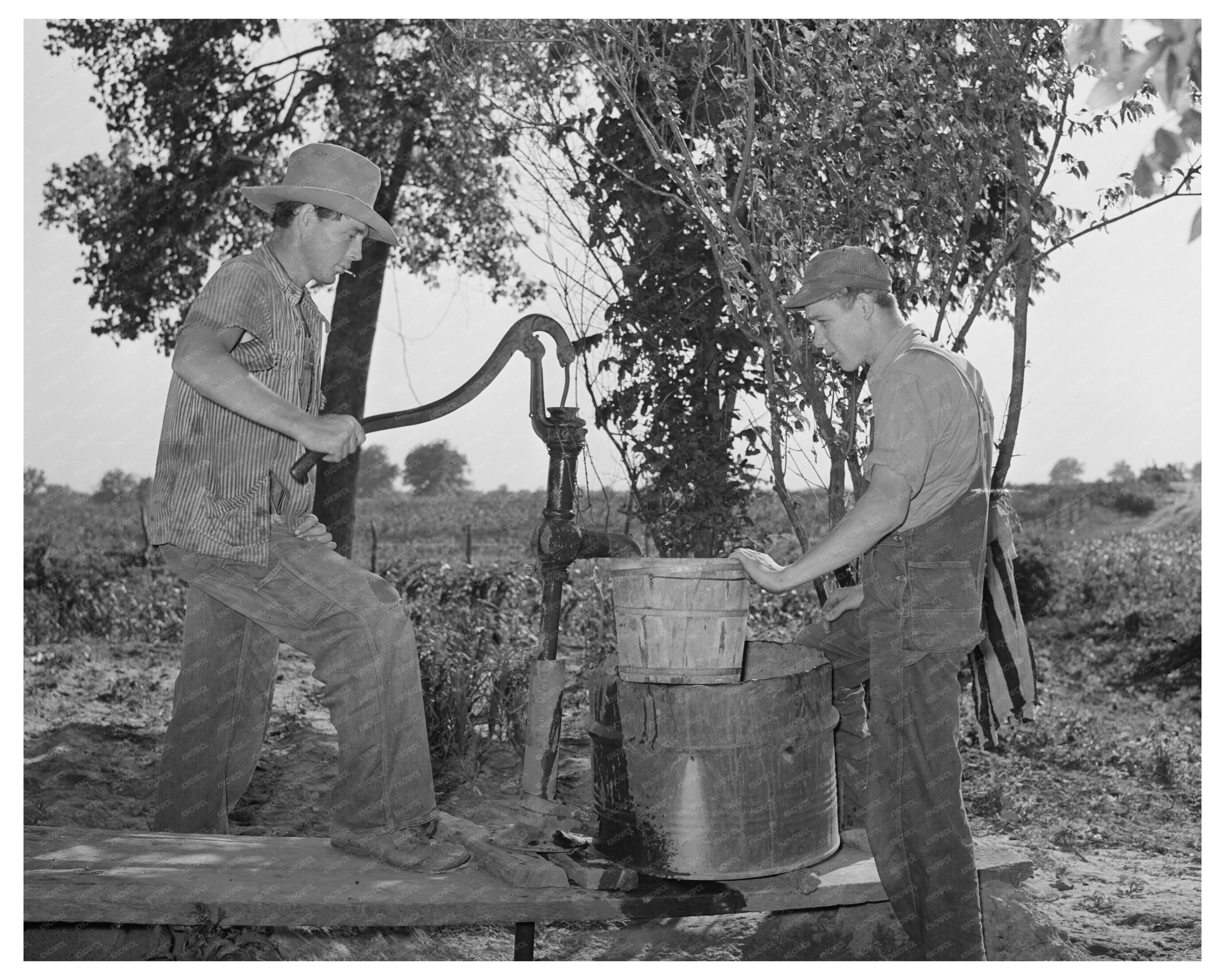 Migrant Boys Pumping Water in Oklahoma June 1939