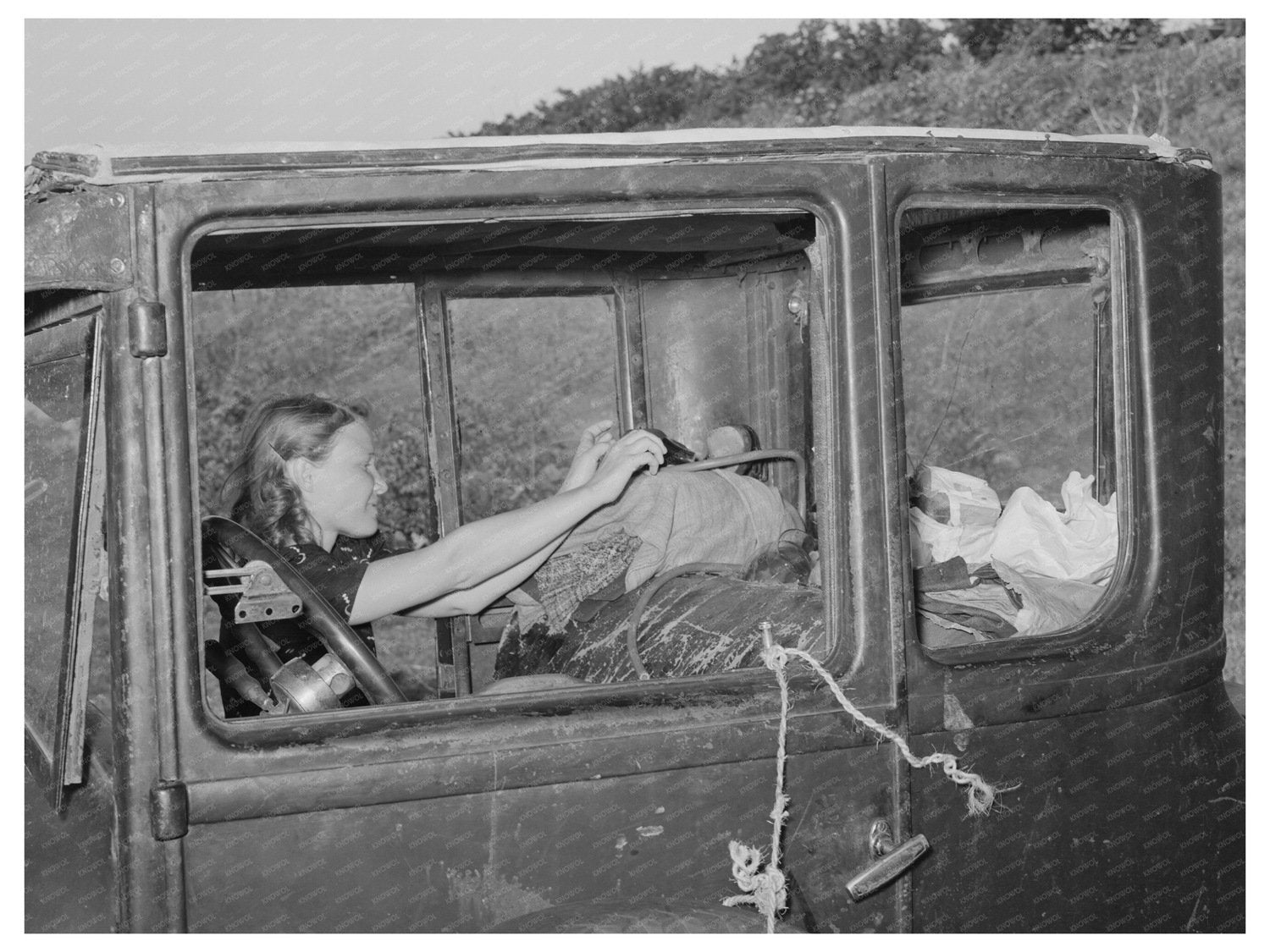 Migrant Woman Reaching for Supplies Near Prague 1939