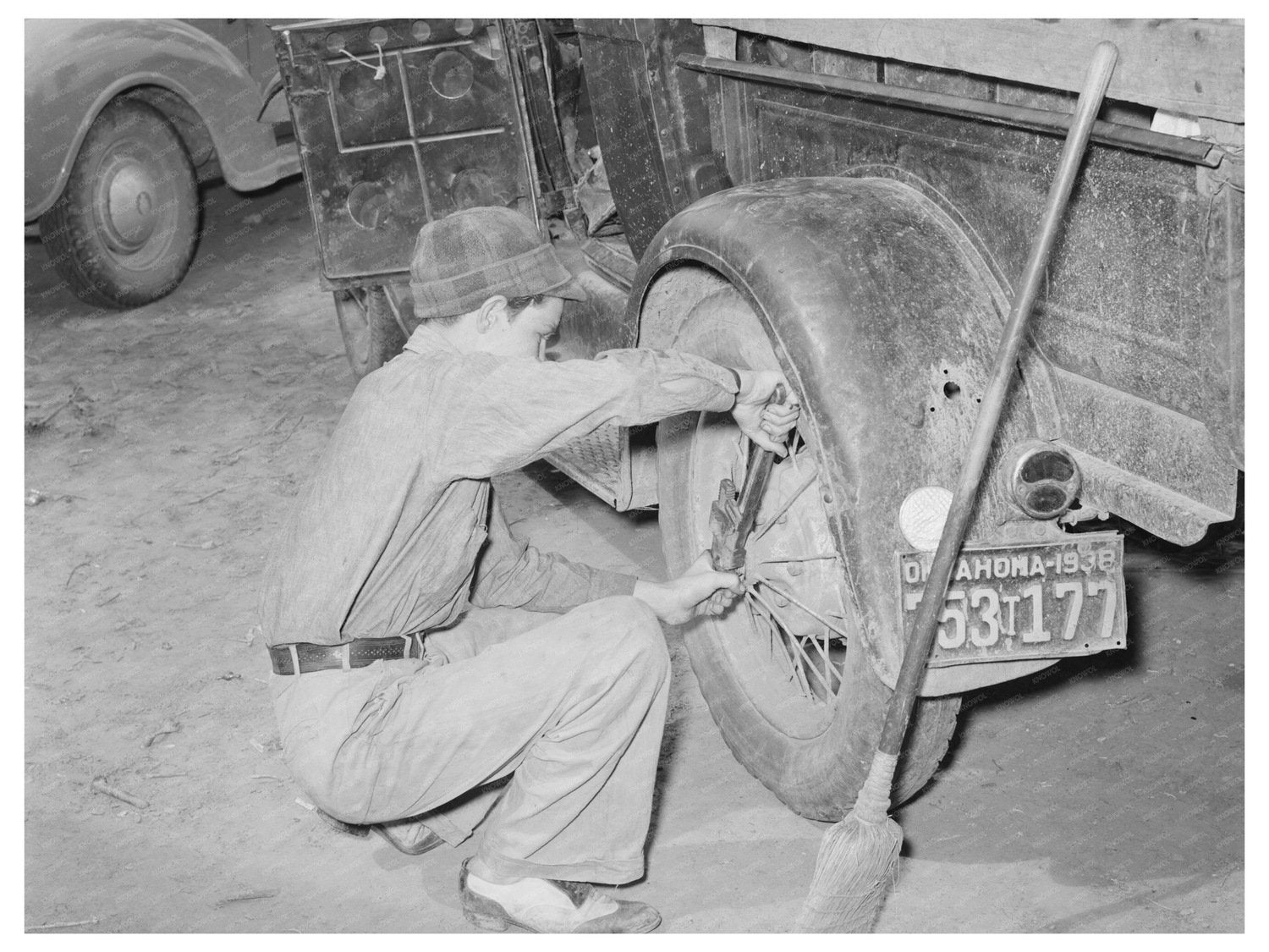 Vintage Family Tightening Truck Wheel in Muskogee 1939