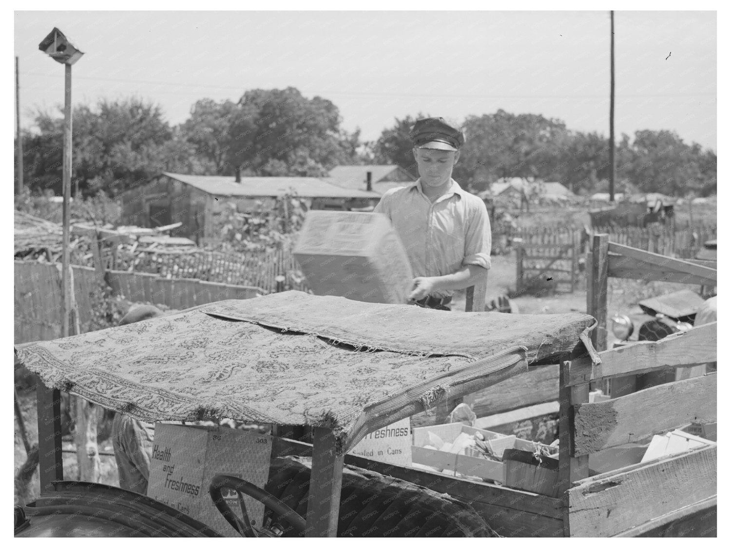 Oklahoma City 1939 Boy Unloading Crates from Oil Truck