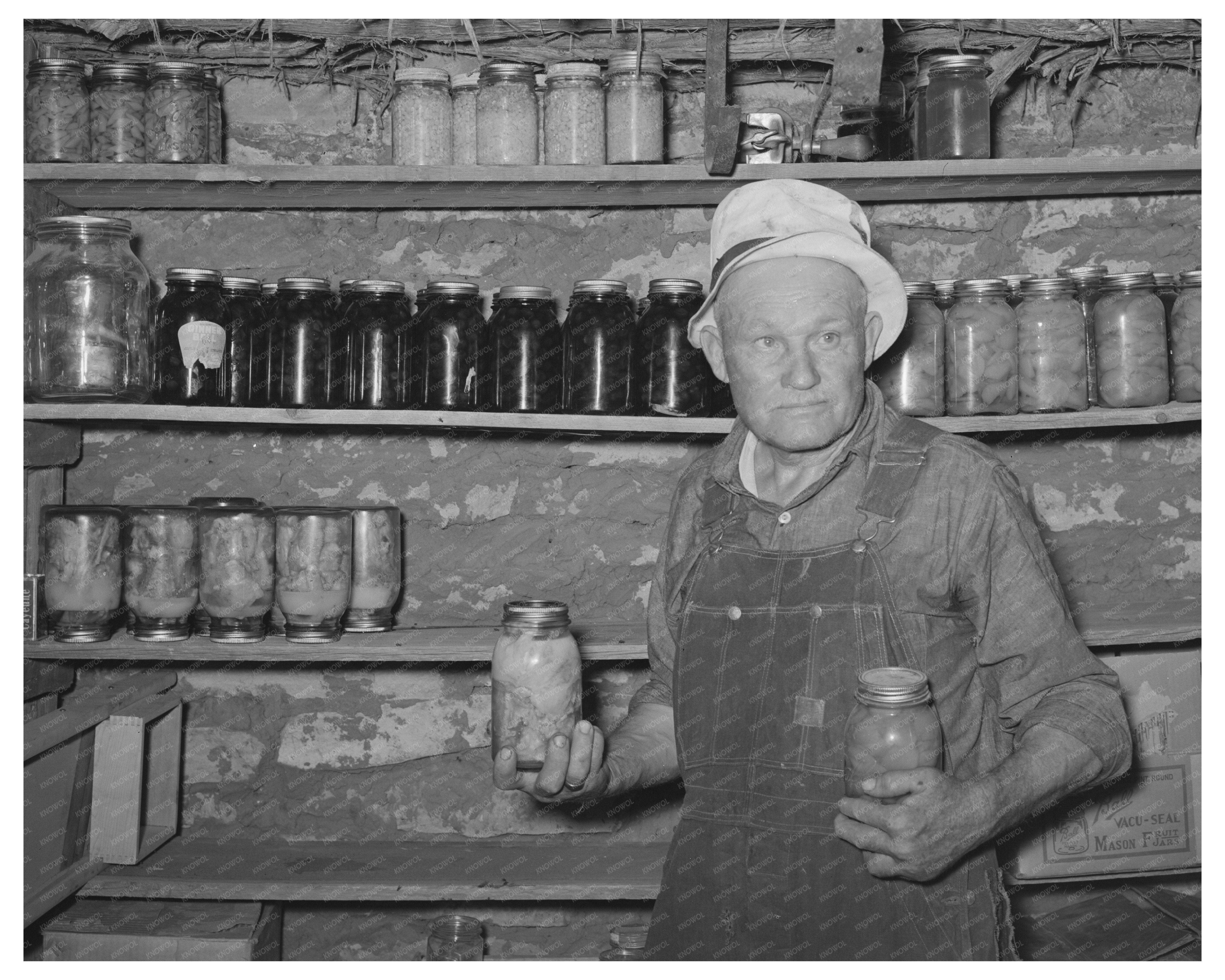 Mr. Bosley with Canned Fruits in Baca County Colorado 1939