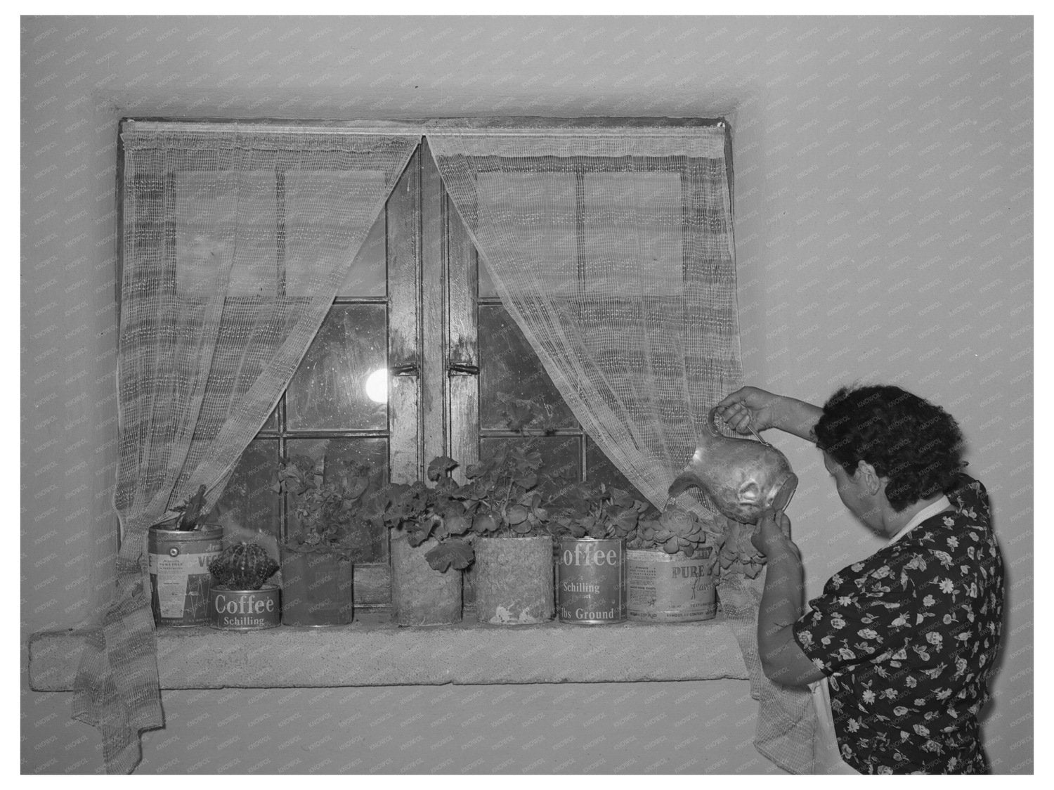 Ofelia Trujillo Sandoval Watering Flowers Taos New Mexico 1939