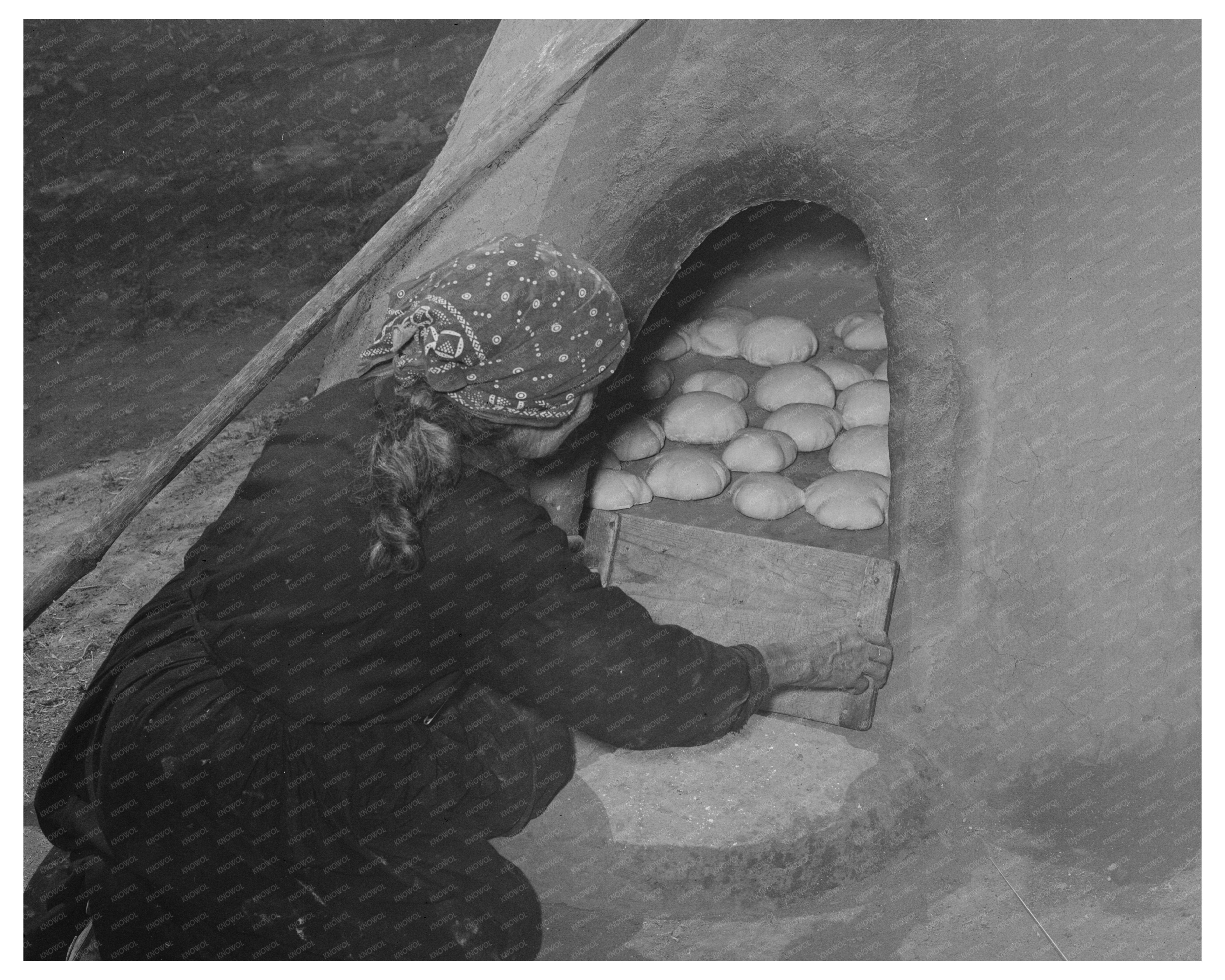Spanish-American Woman Baking Bread in Taos County 1939