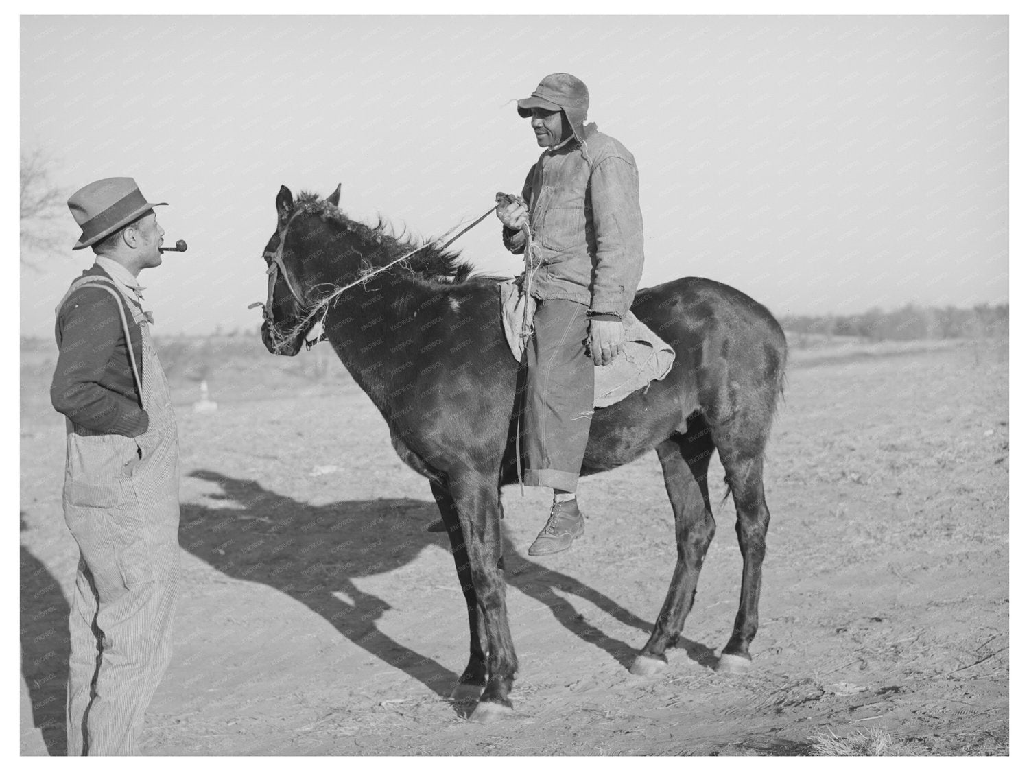 Pomp Hall Converses with Neighbor in Oklahoma 1940
