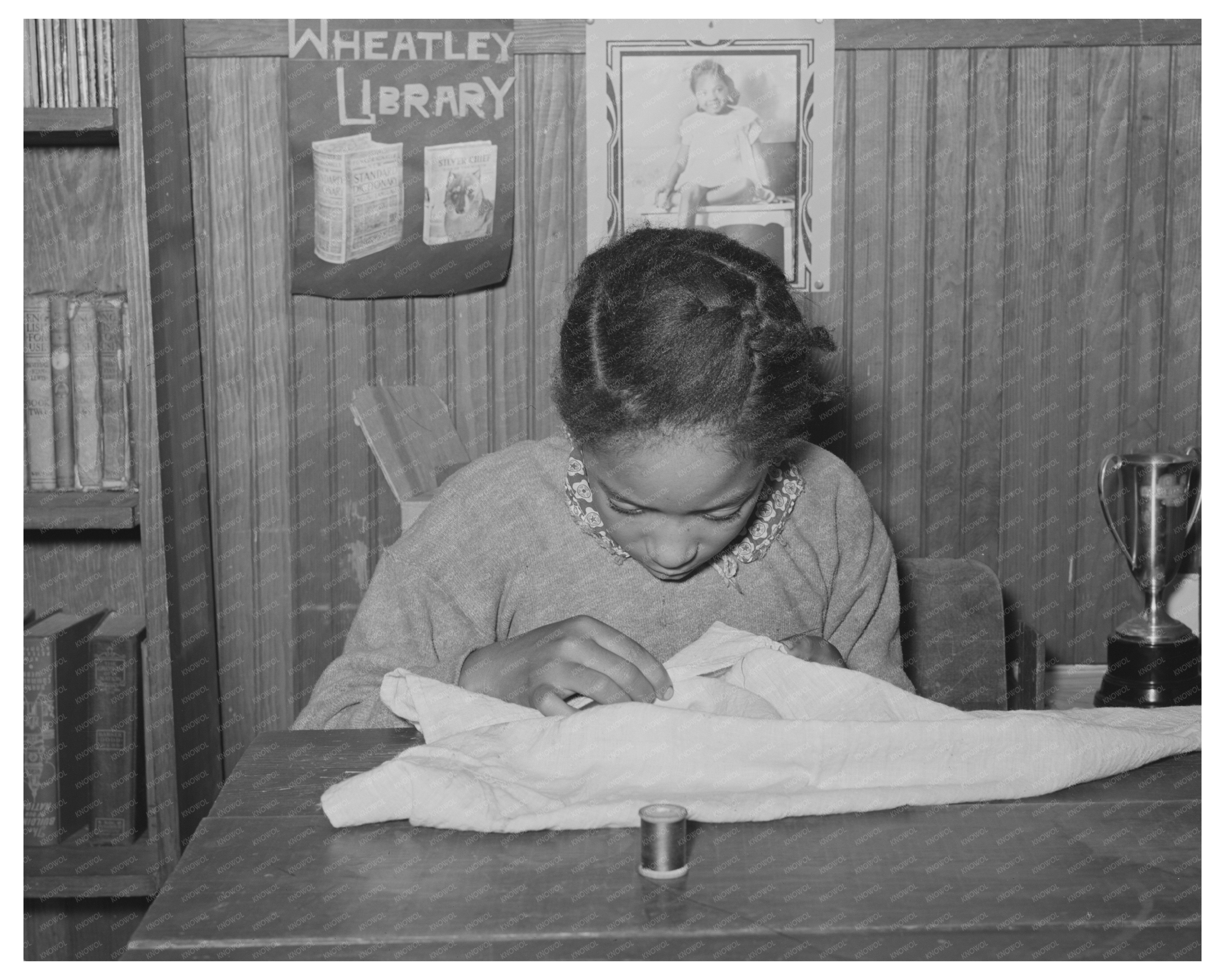 Daughter of Tenant Farmer Sewing in Oklahoma 1944
