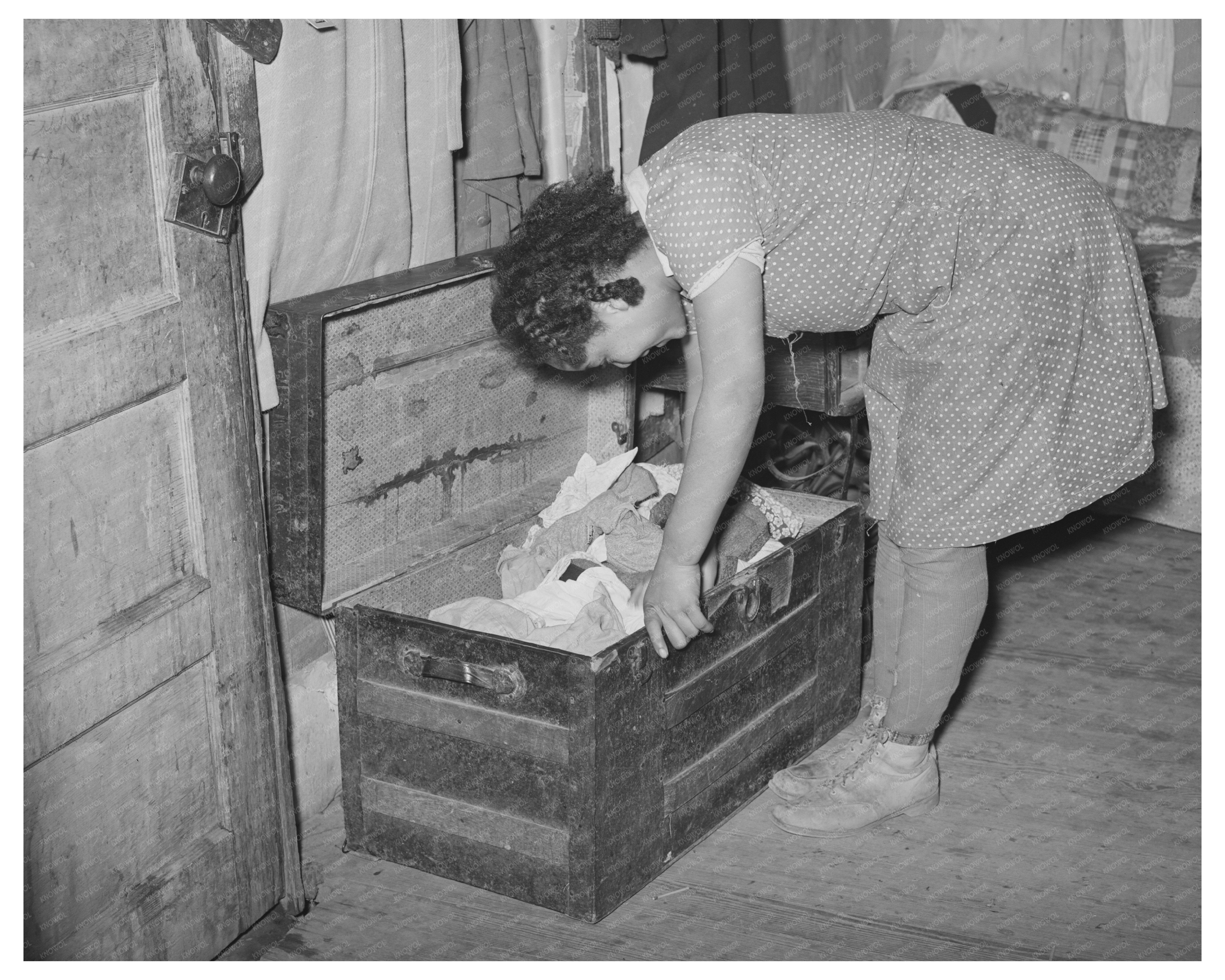 Girl Exploring Trunk of Clothing in Oklahoma February 1940