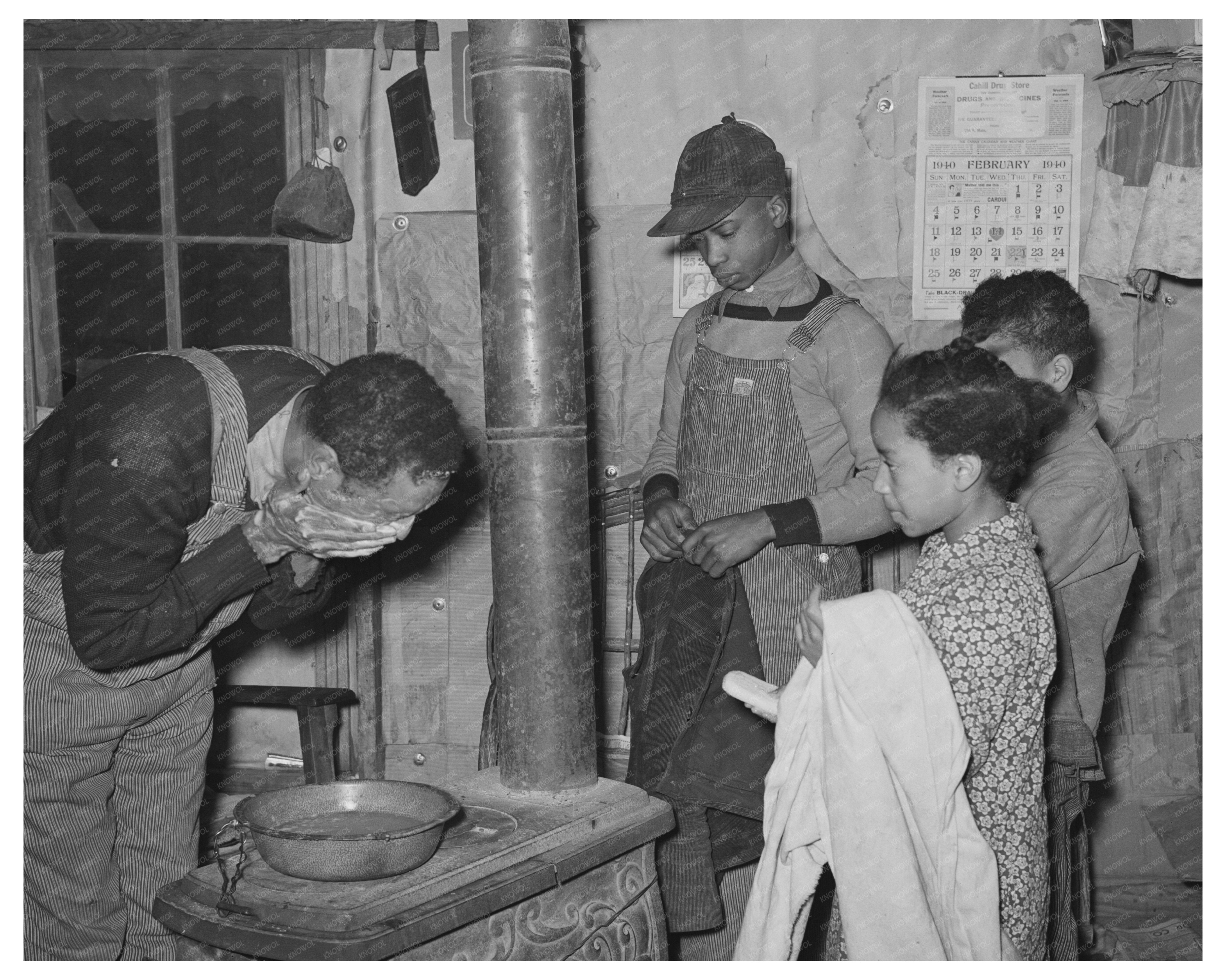 Pomp Hall Washing Face with Children Creek County 1944