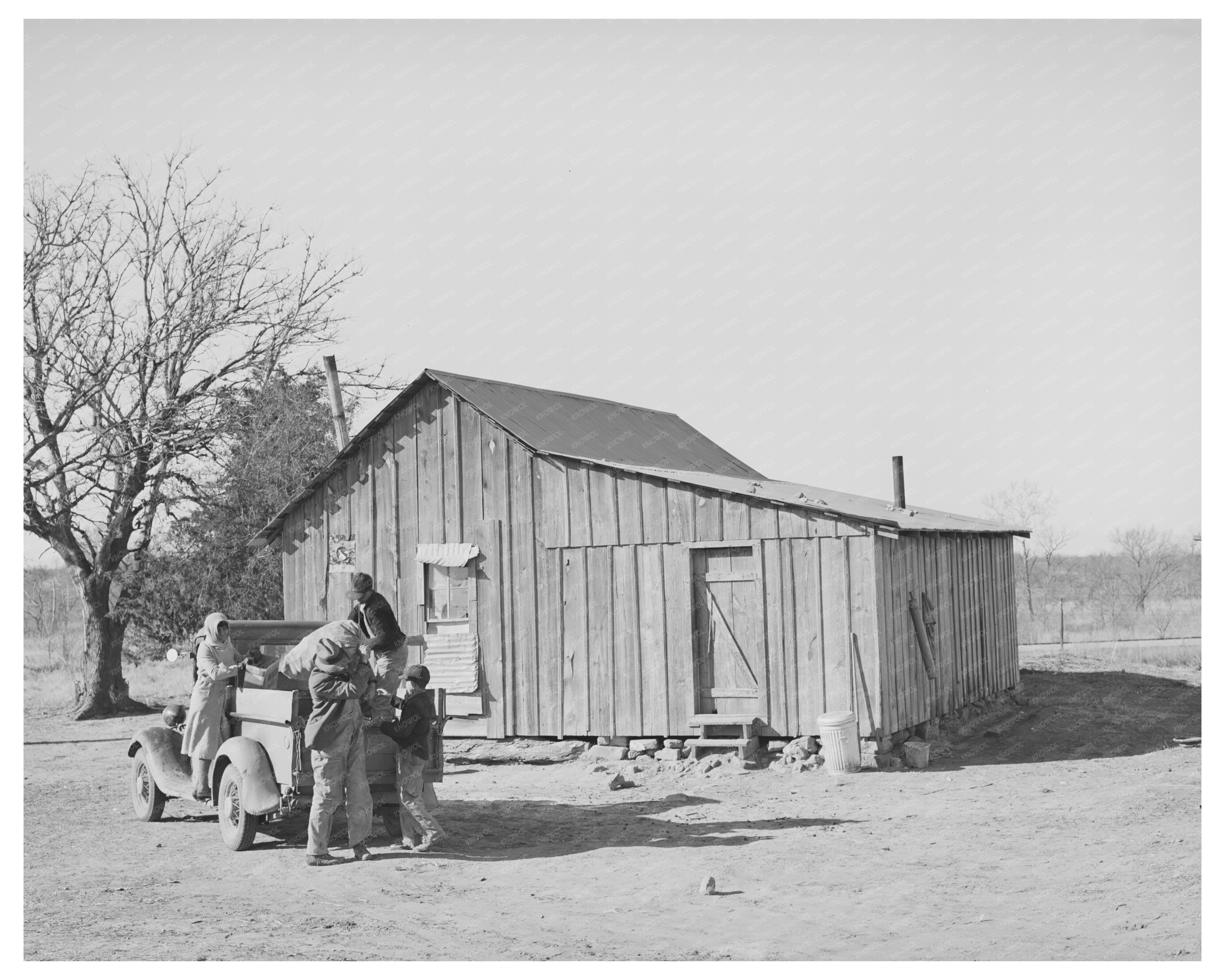 Pomp Hall Family Unloading Truck in Creek County 1940