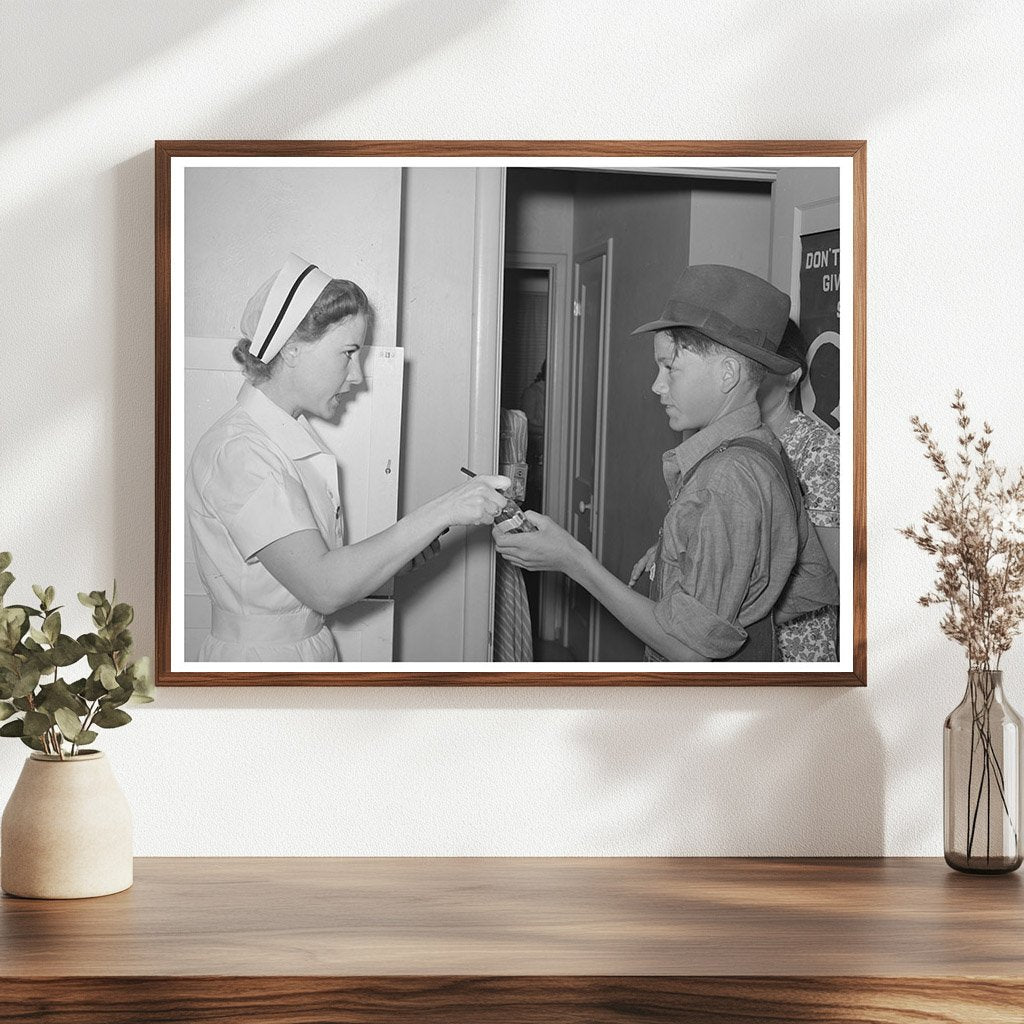 Nurse Instructs Migratory Laborers Son on Medication 1940