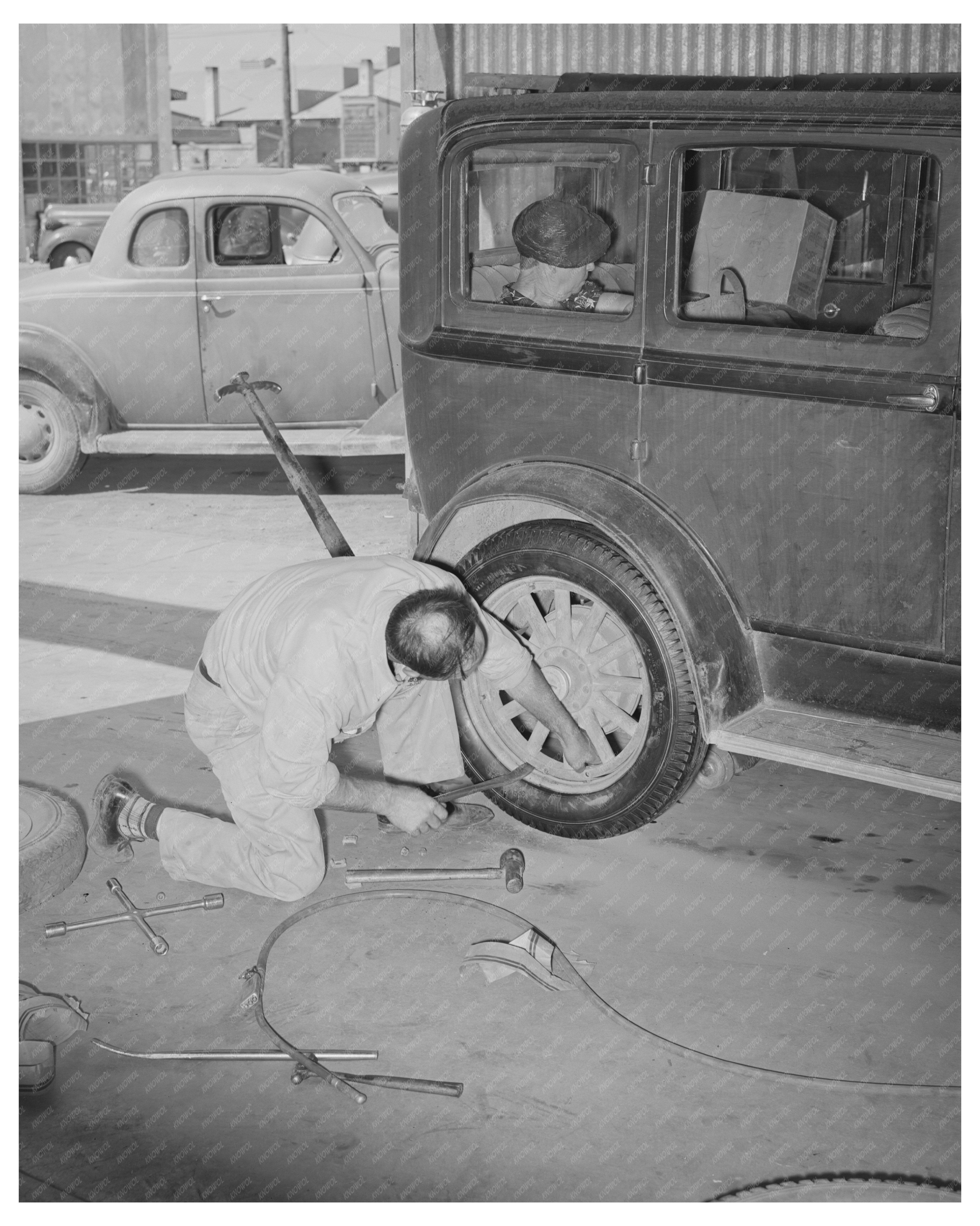 Changing a Tire at Cooperative Station Phoenix May 1940