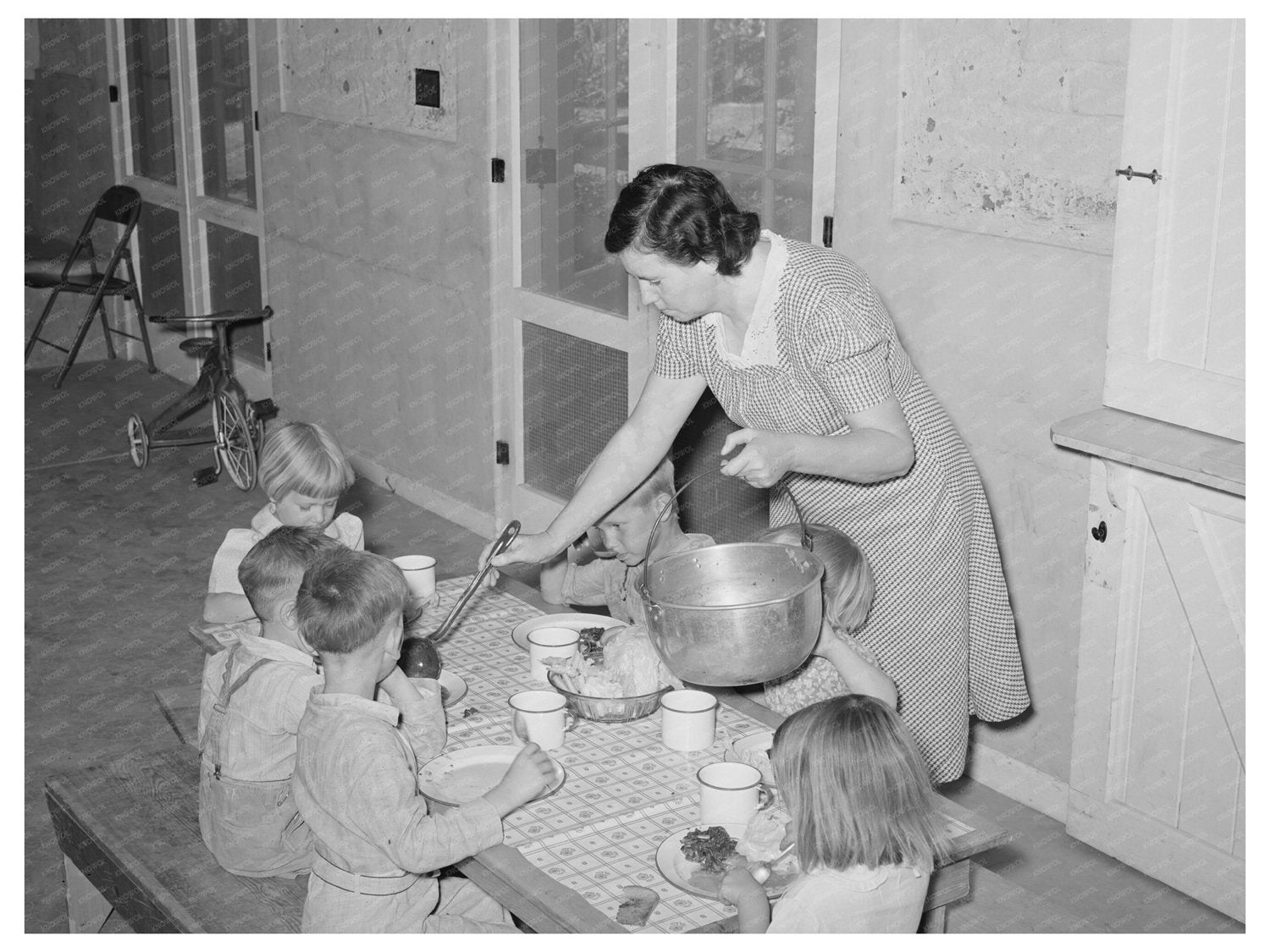 Nursery School Supervisor Assisting Children April 1940