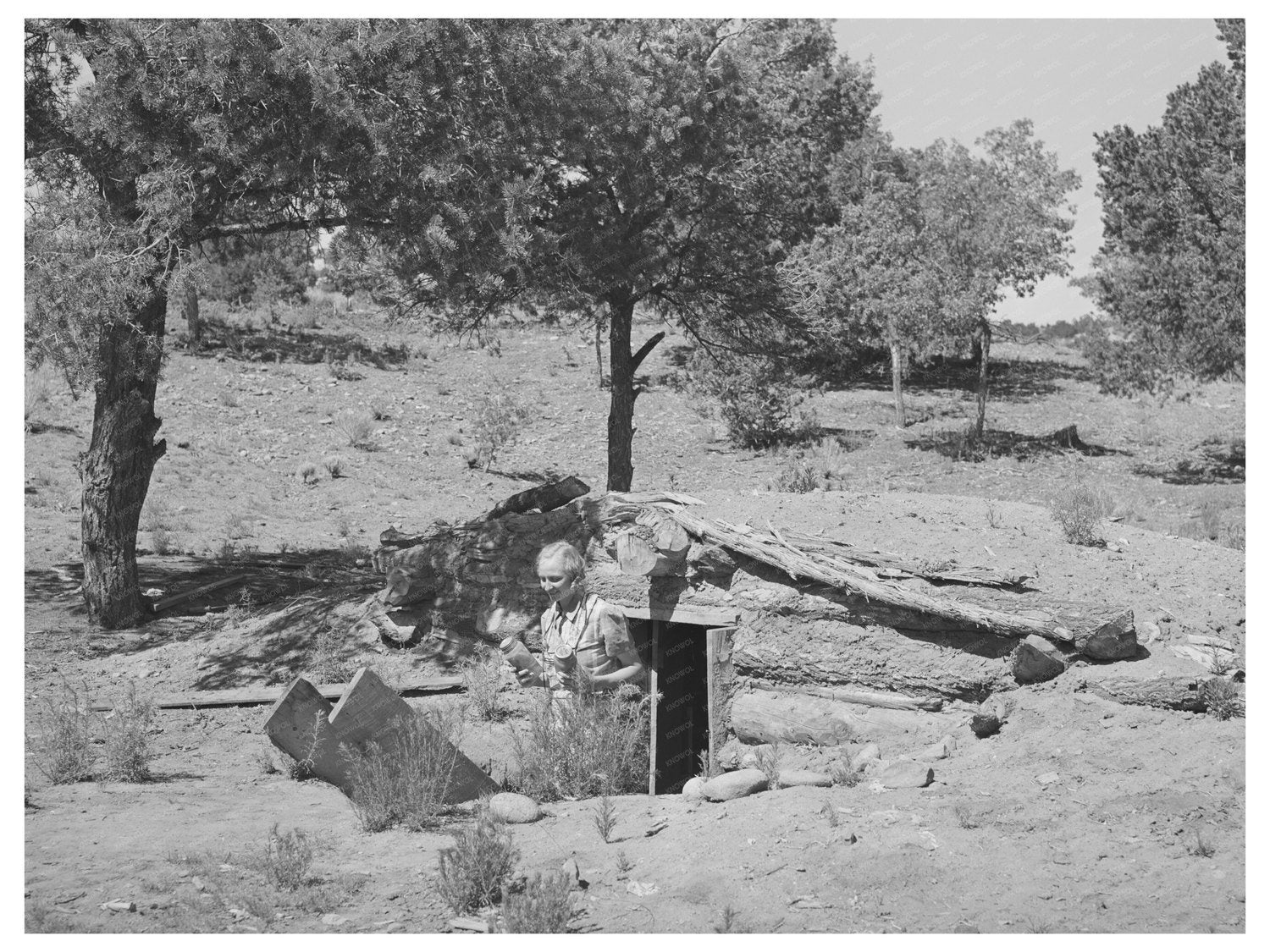 Mrs. Faro Caudill with Cans of Fruit in Pie Town 1940