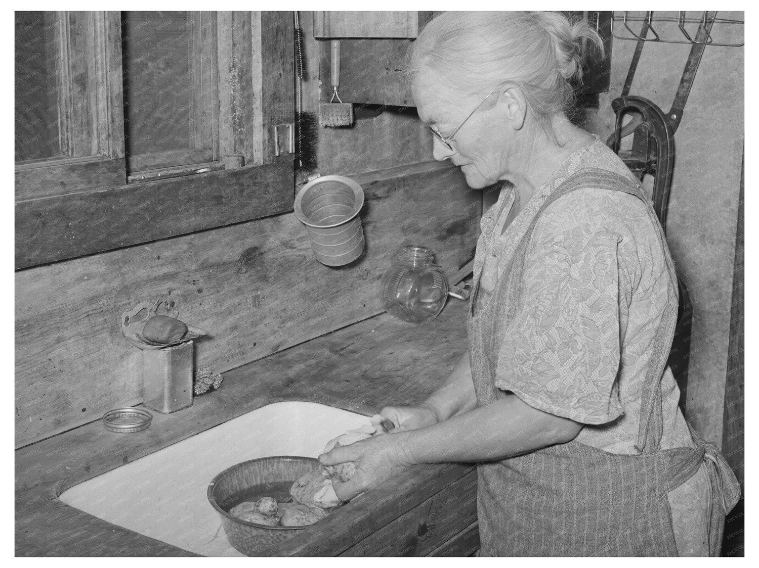 Homesteaders Wife Peeling Potatoes in Pie Town 1940