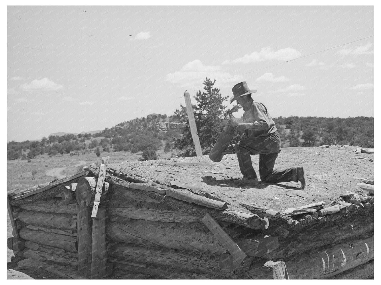 Faro Caudill Dismantles Chimney in Pie Town New Mexico 1940