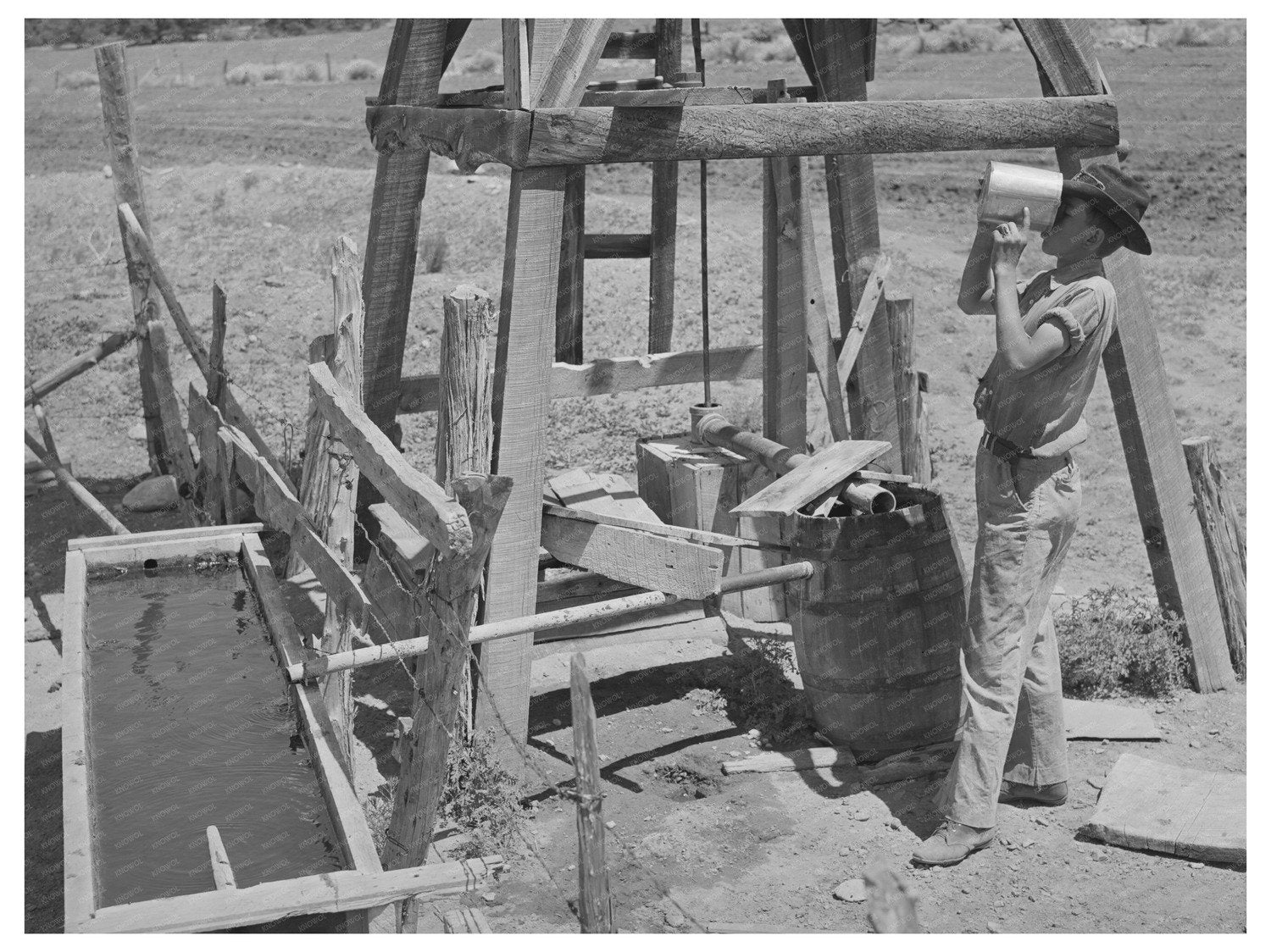 Farm Boy Drinking from Well in Pie Town New Mexico 1940