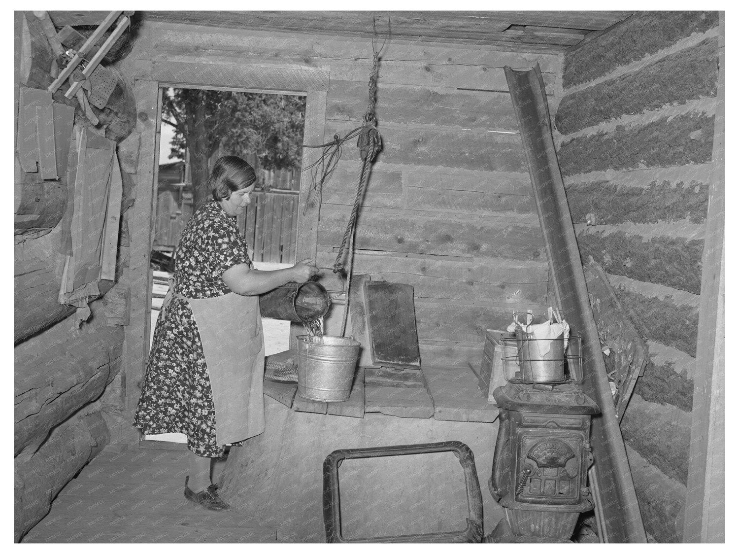 Mrs. Bill Stagg Drawing Water from Well Pie Town New Mexico 1940