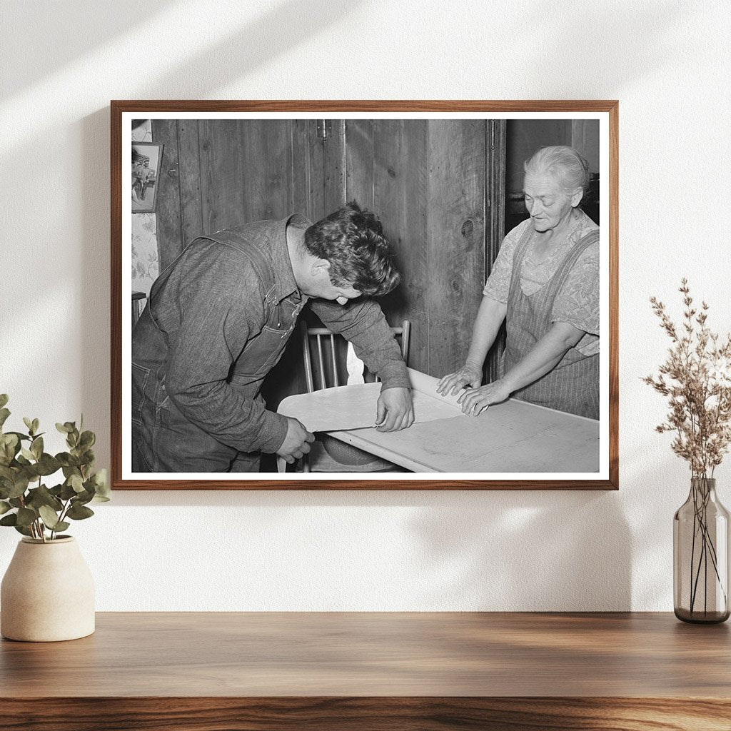 Mrs. George Hutton and Son Measuring Paper in Pie Town 1940